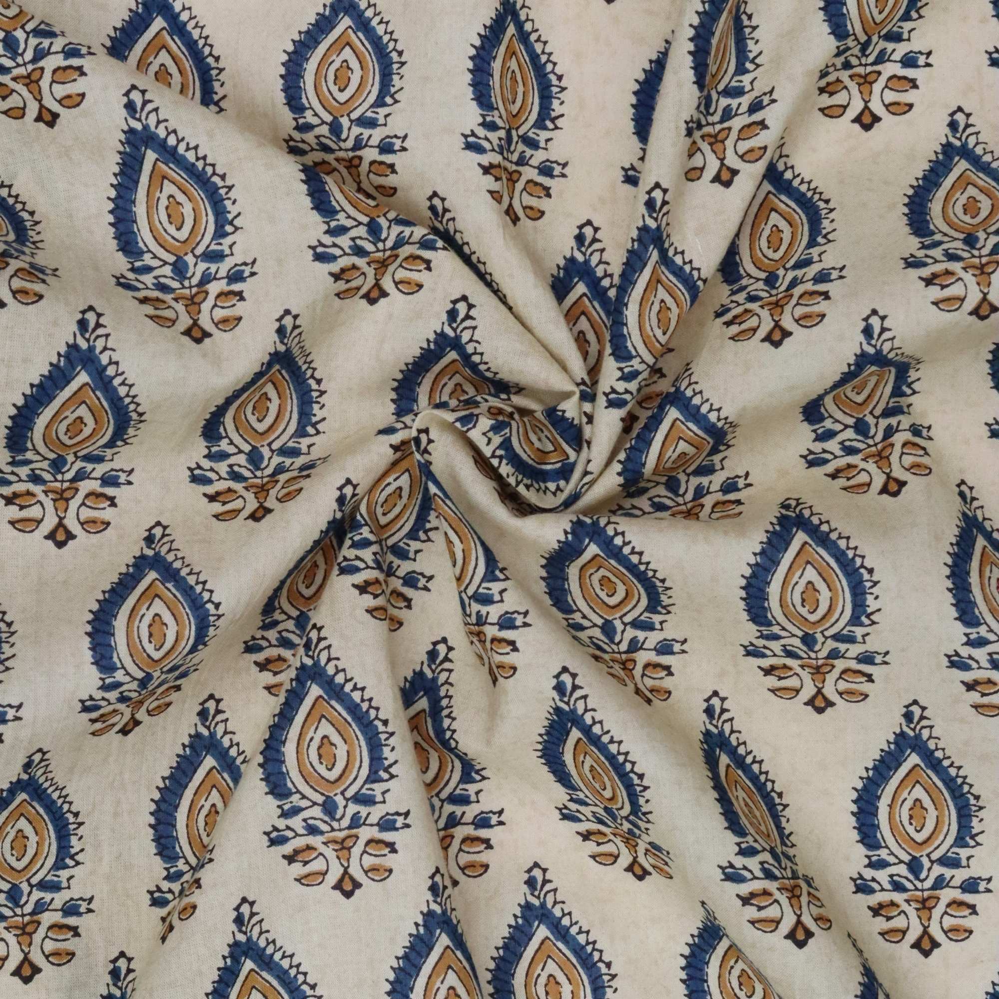 Fabric with blue and brown geometric pattern on a beige background