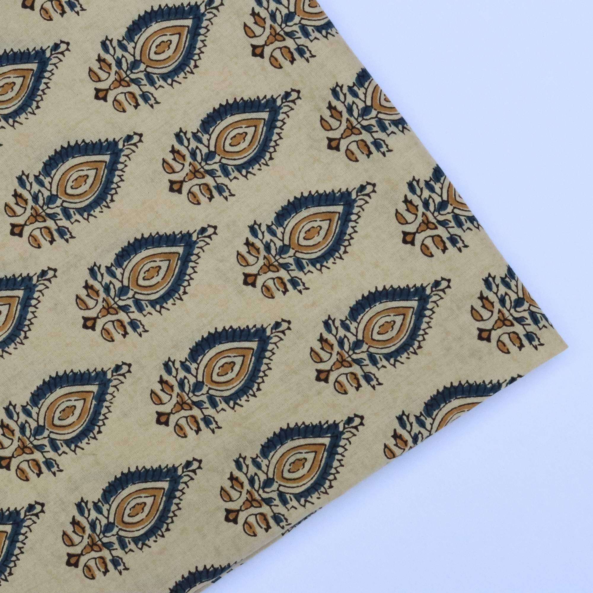 Beige fabric with blue and brown pattern on a white background