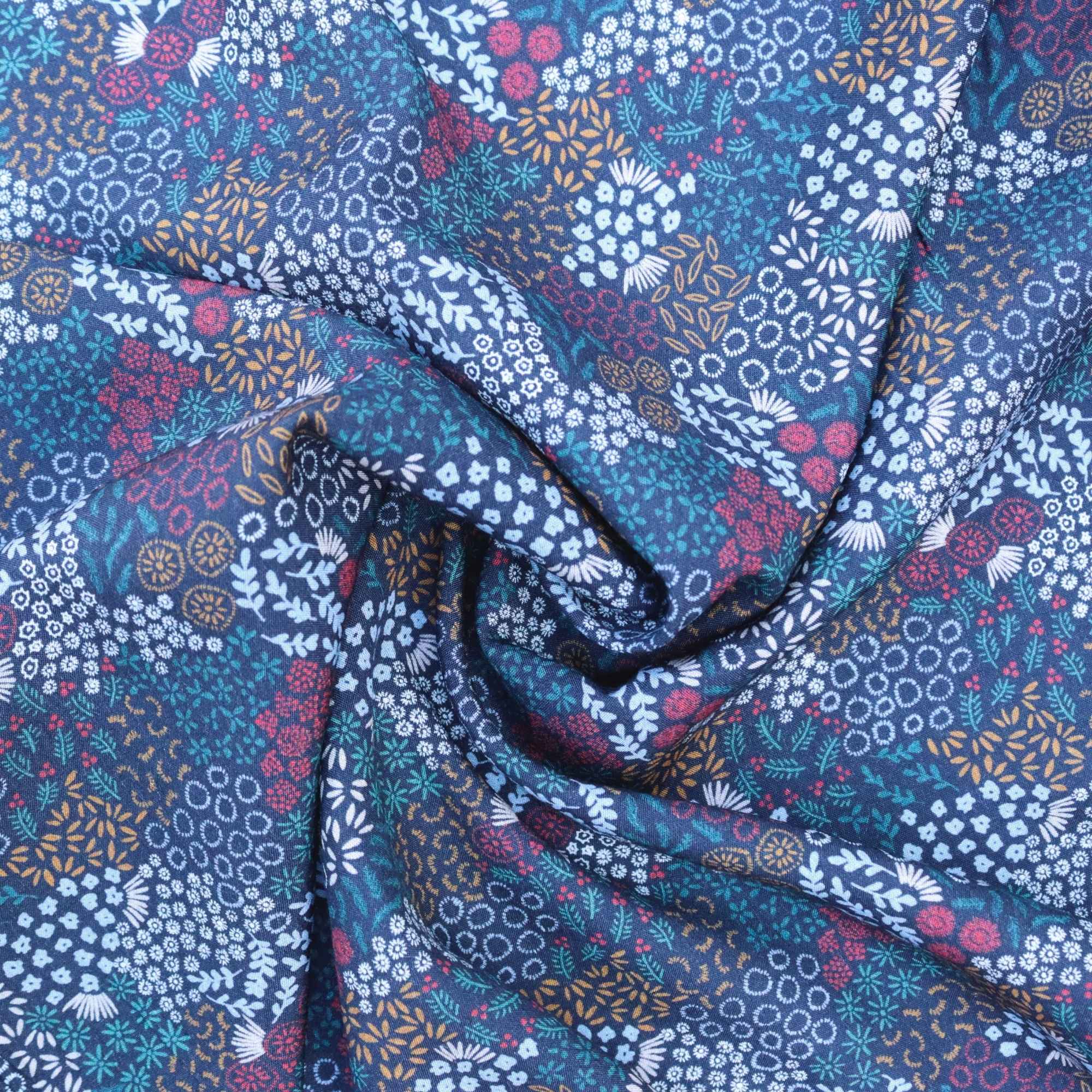 Floral patterned fabric with blue, purple, and white colors.