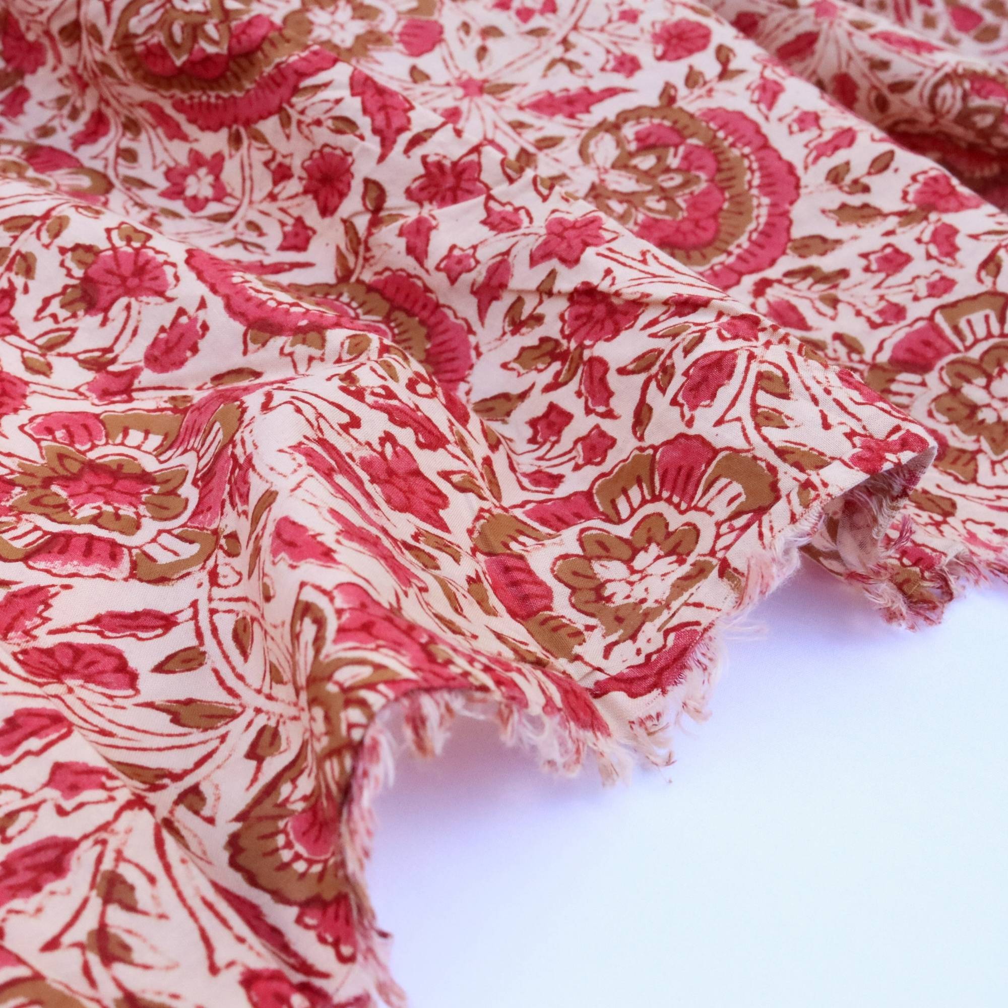 Red and white patterned fabric on a white background