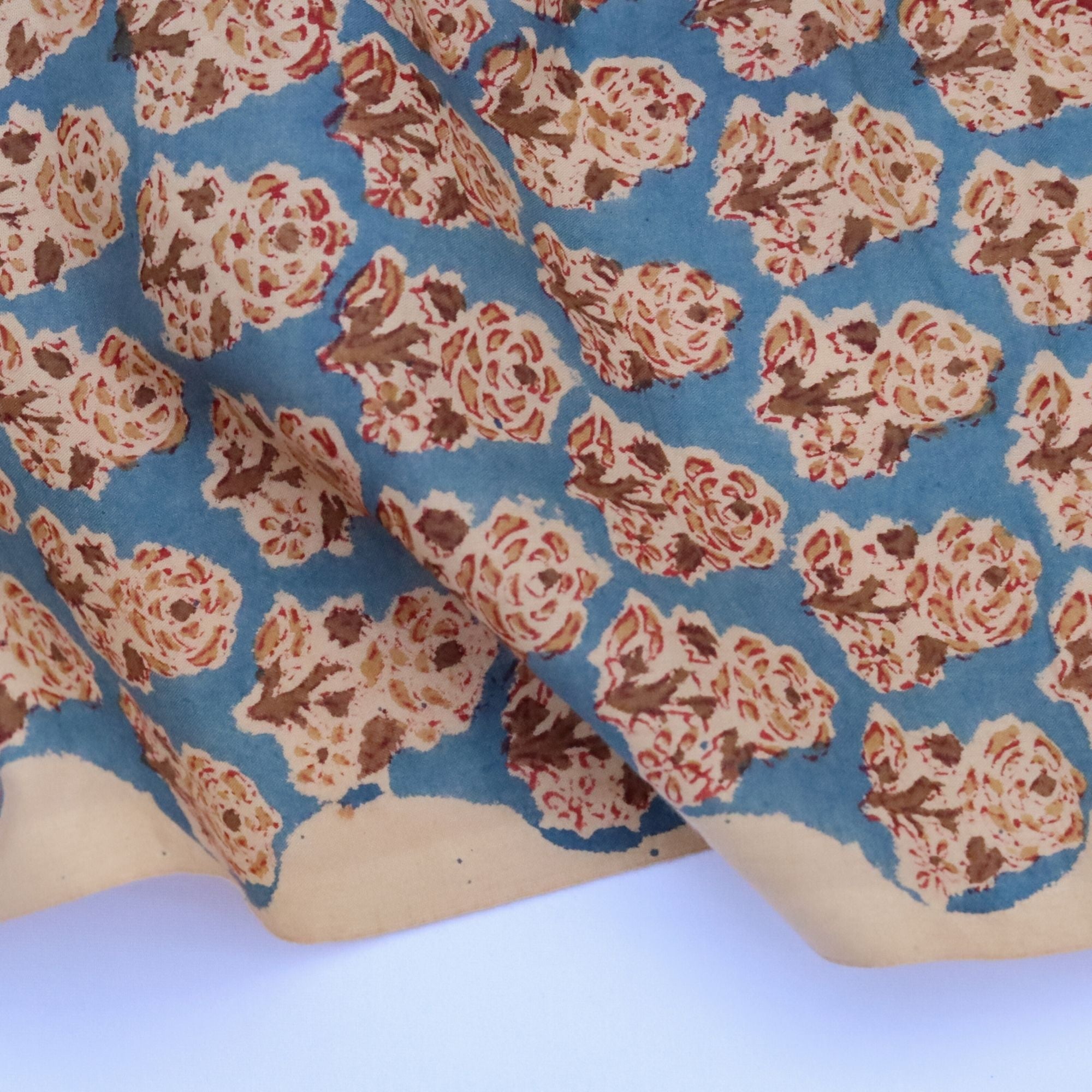 Floral patterned fabric with blue background