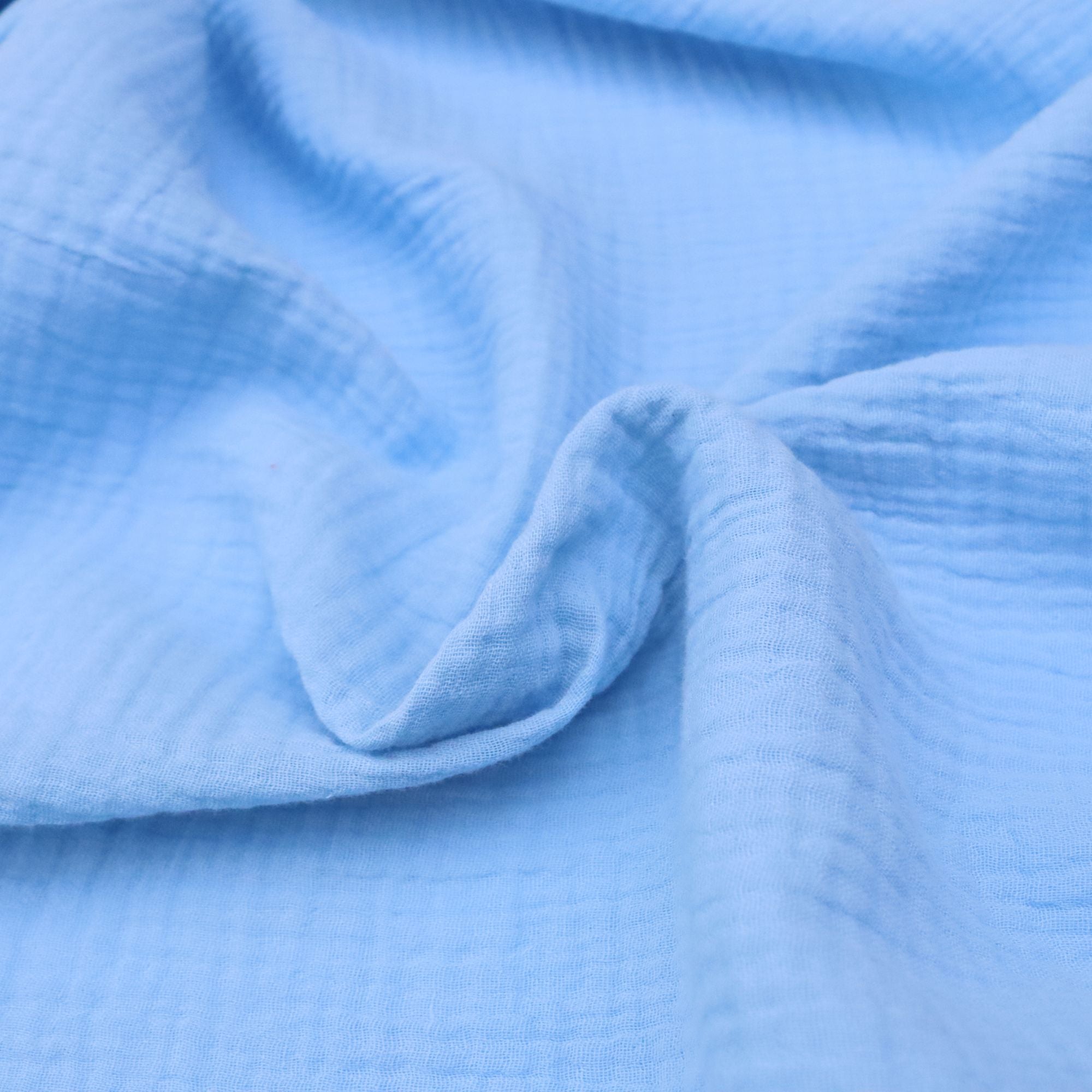 Close-up of blue fabric with a textured pattern