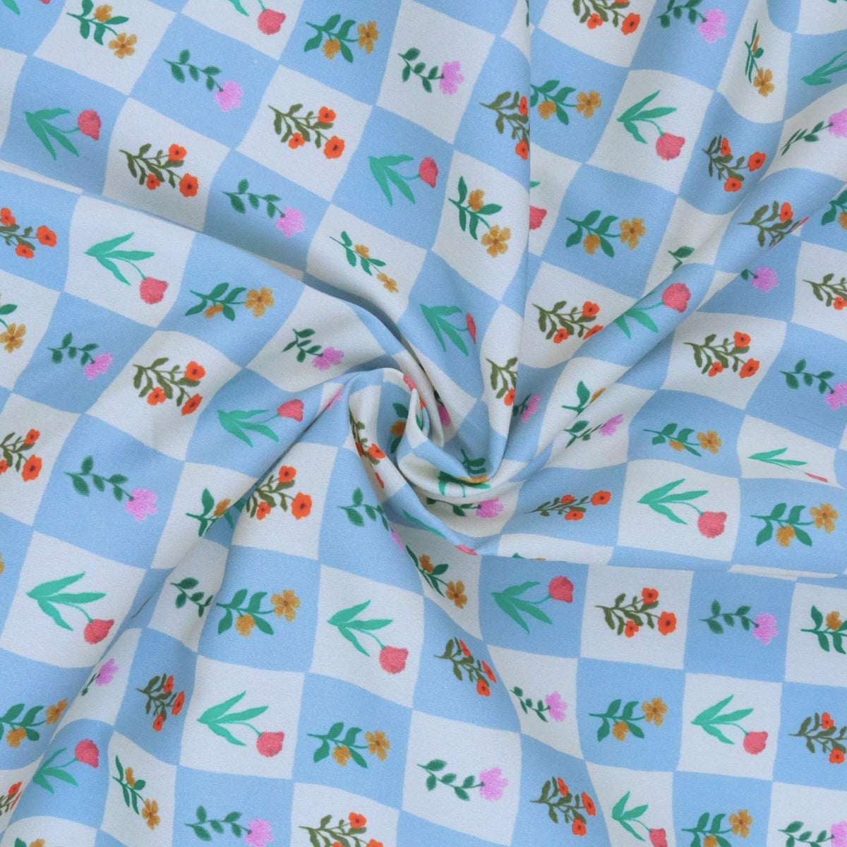 Floral patterned fabric with blue and white checkered background