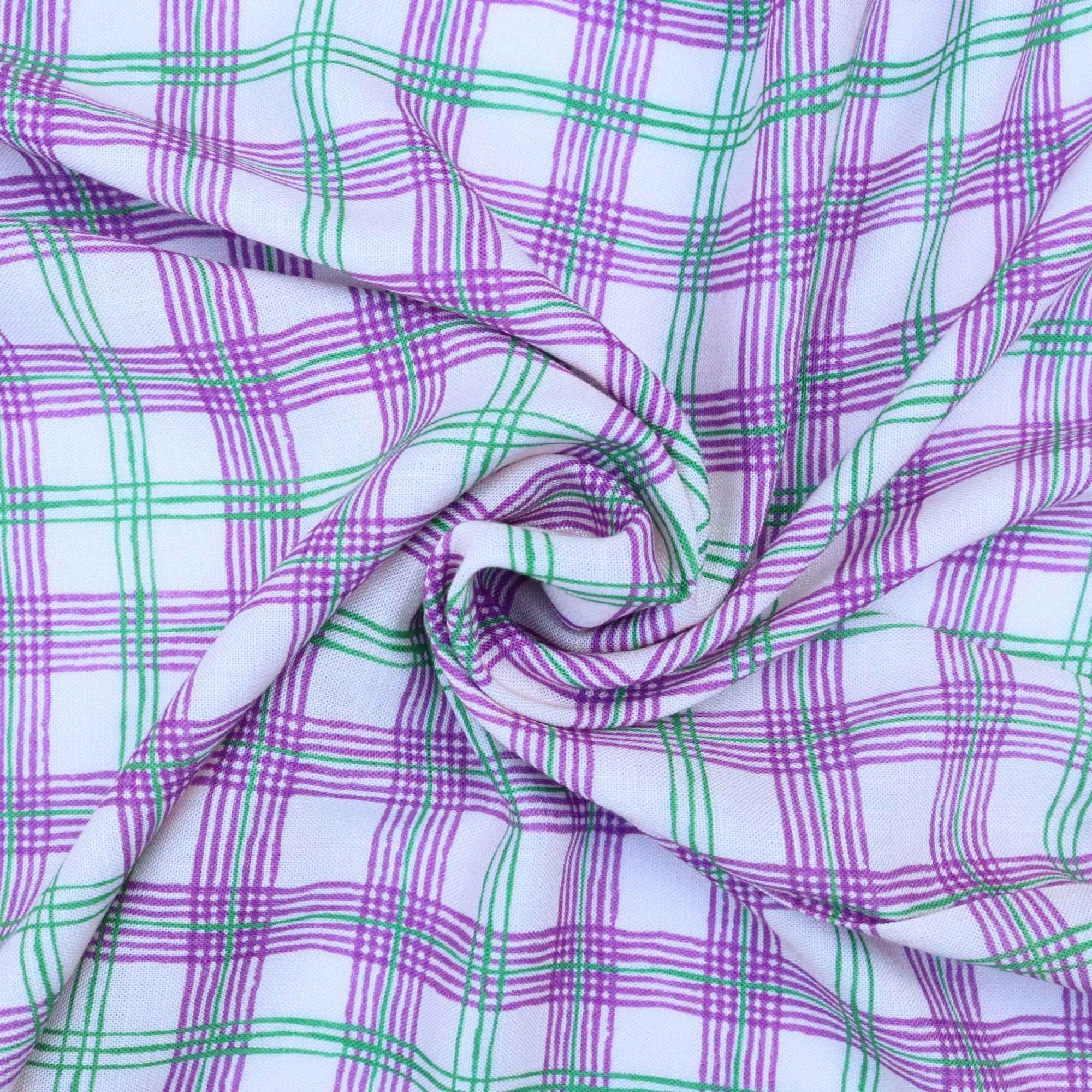 Plaid fabric with purple and green lines on a white background