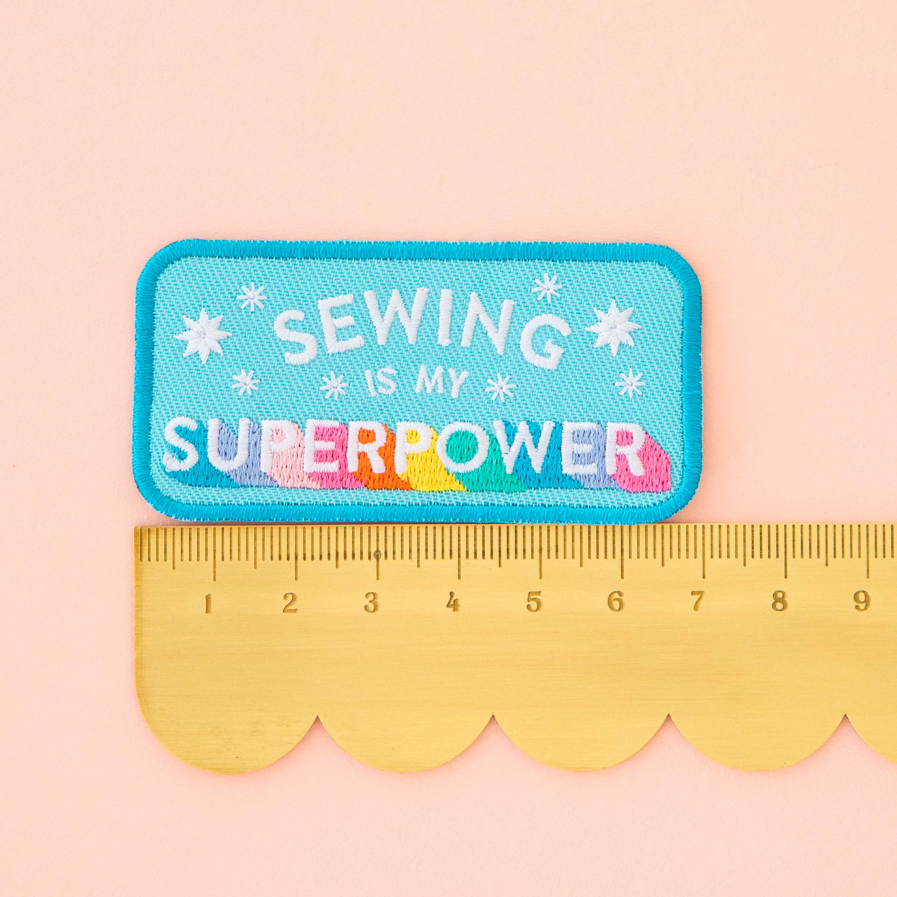 Embroidered patch with &