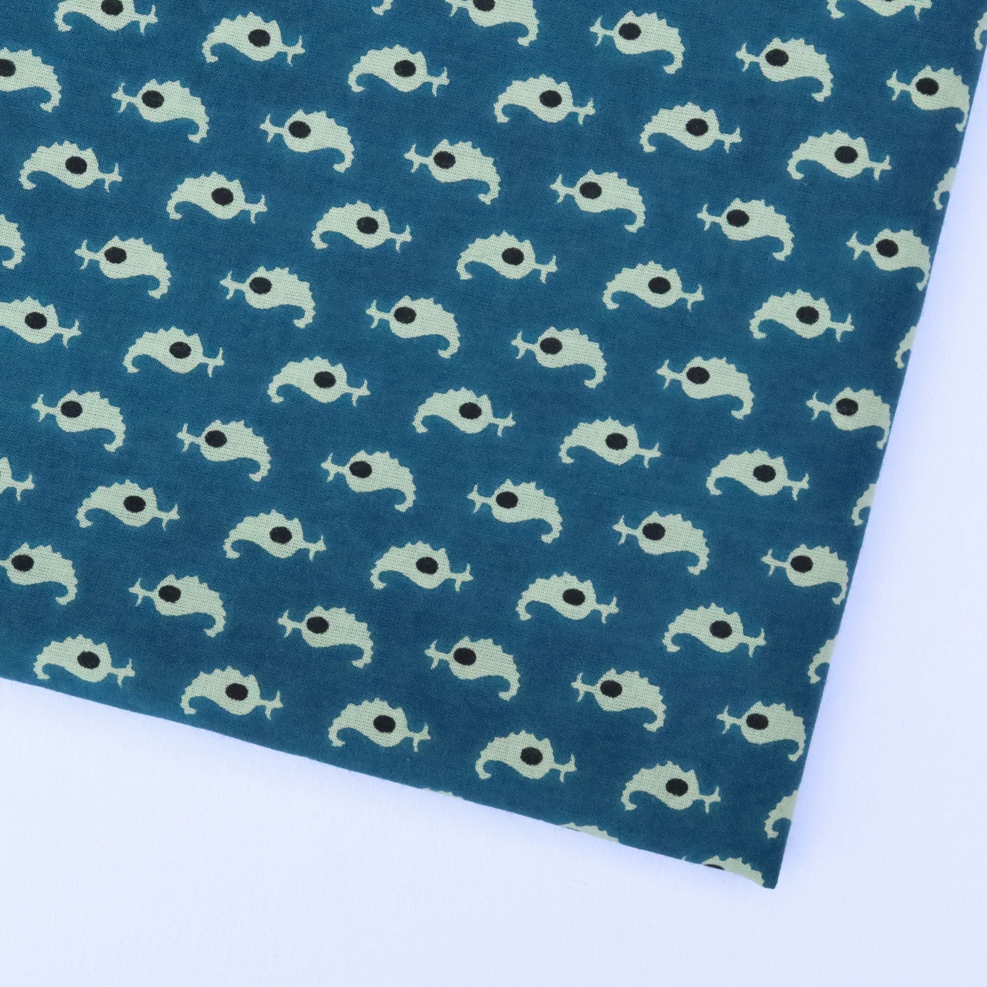 Patterned paper with fish design on a blue background