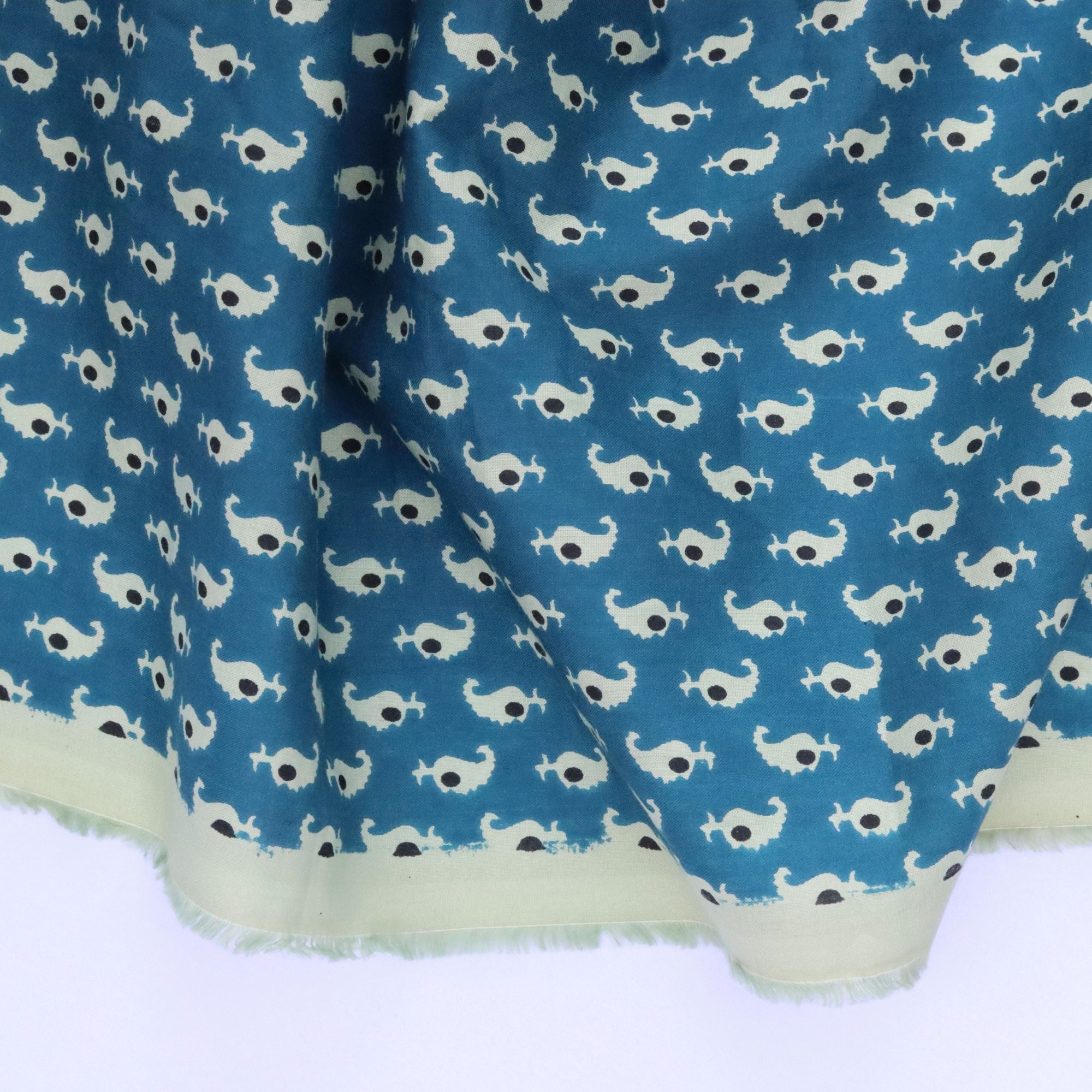 Fabric with whale pattern on a blue background