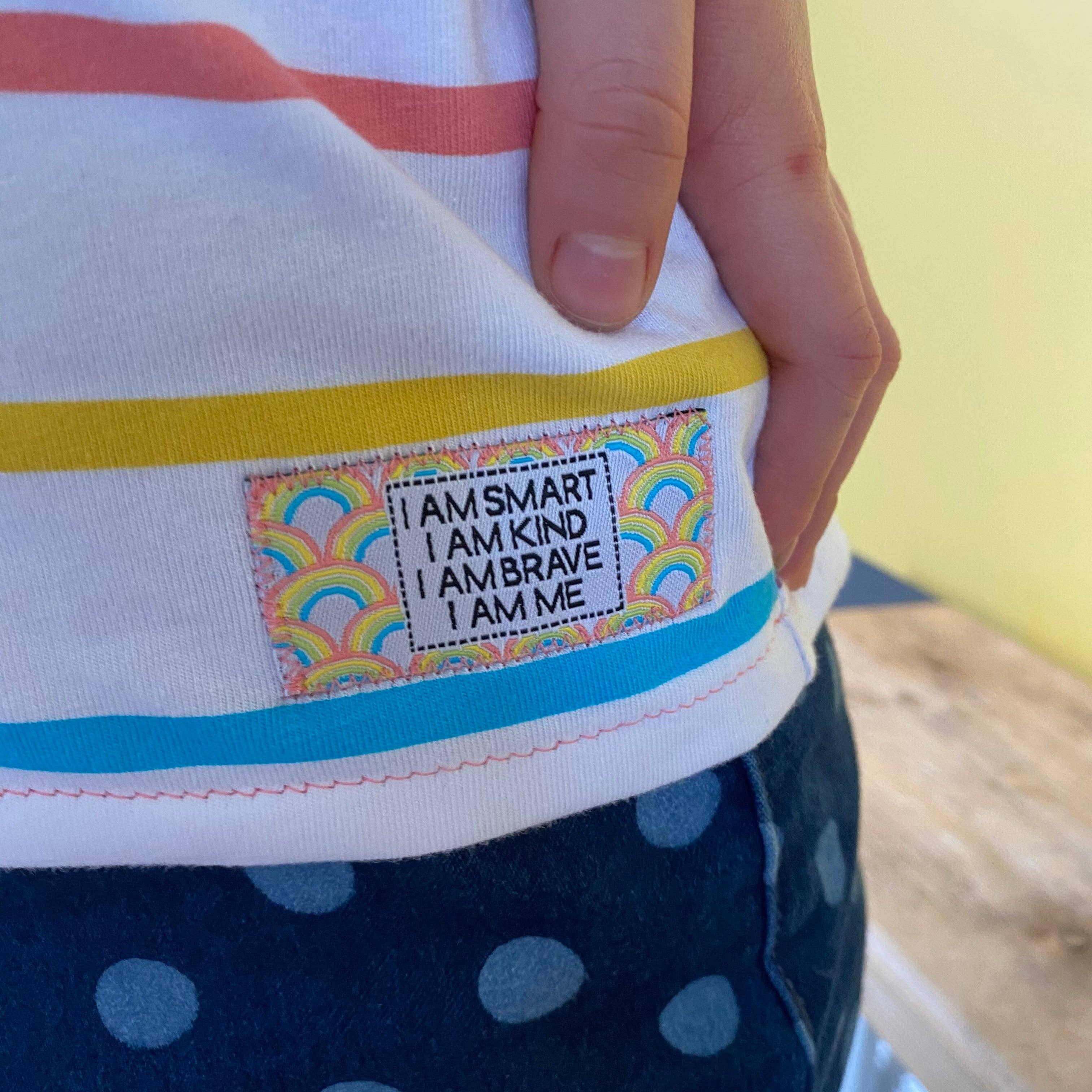 Close up of the Sew in Woven Label, stitched in to as stripey shirt.