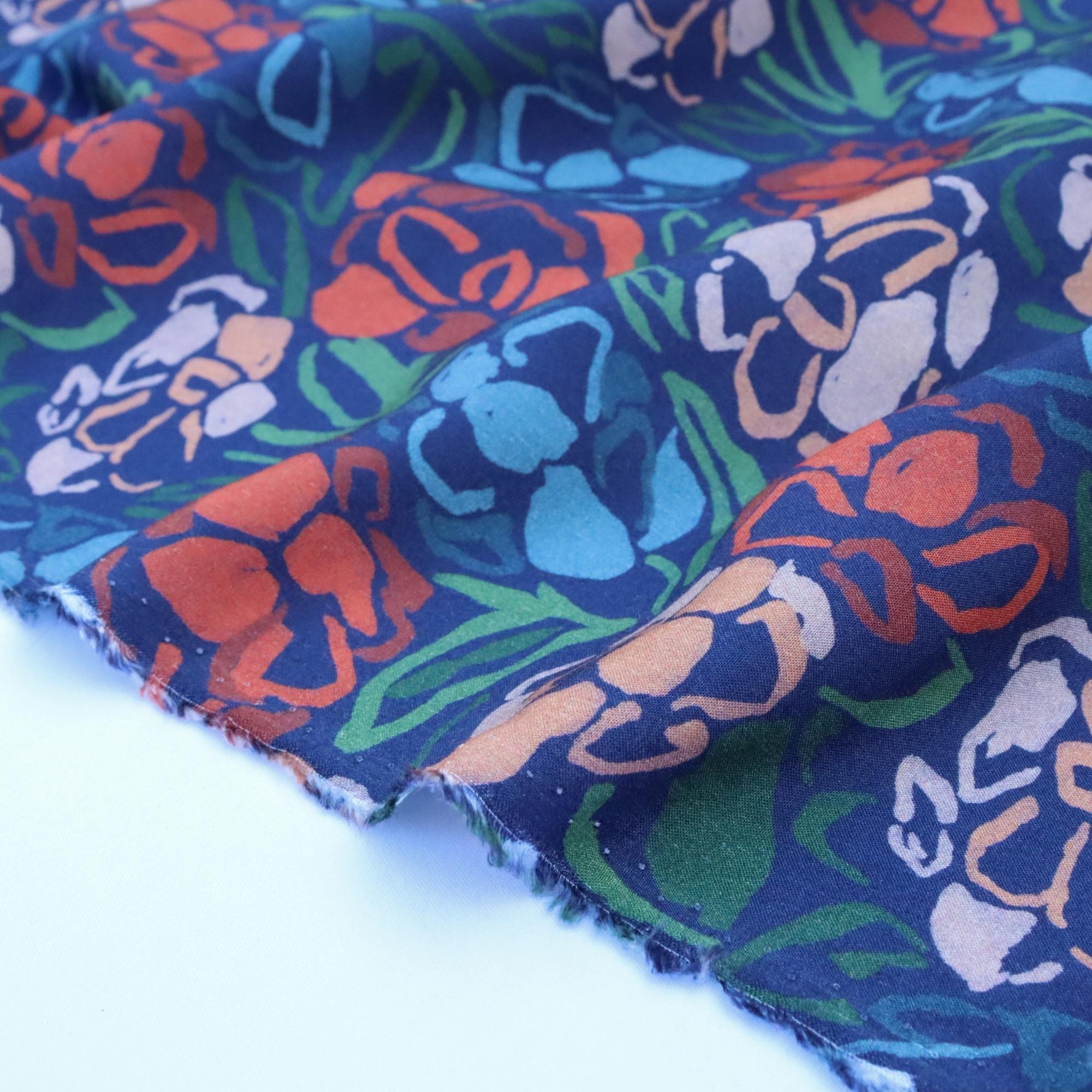 Colorful fabric with elephant pattern on a blue background