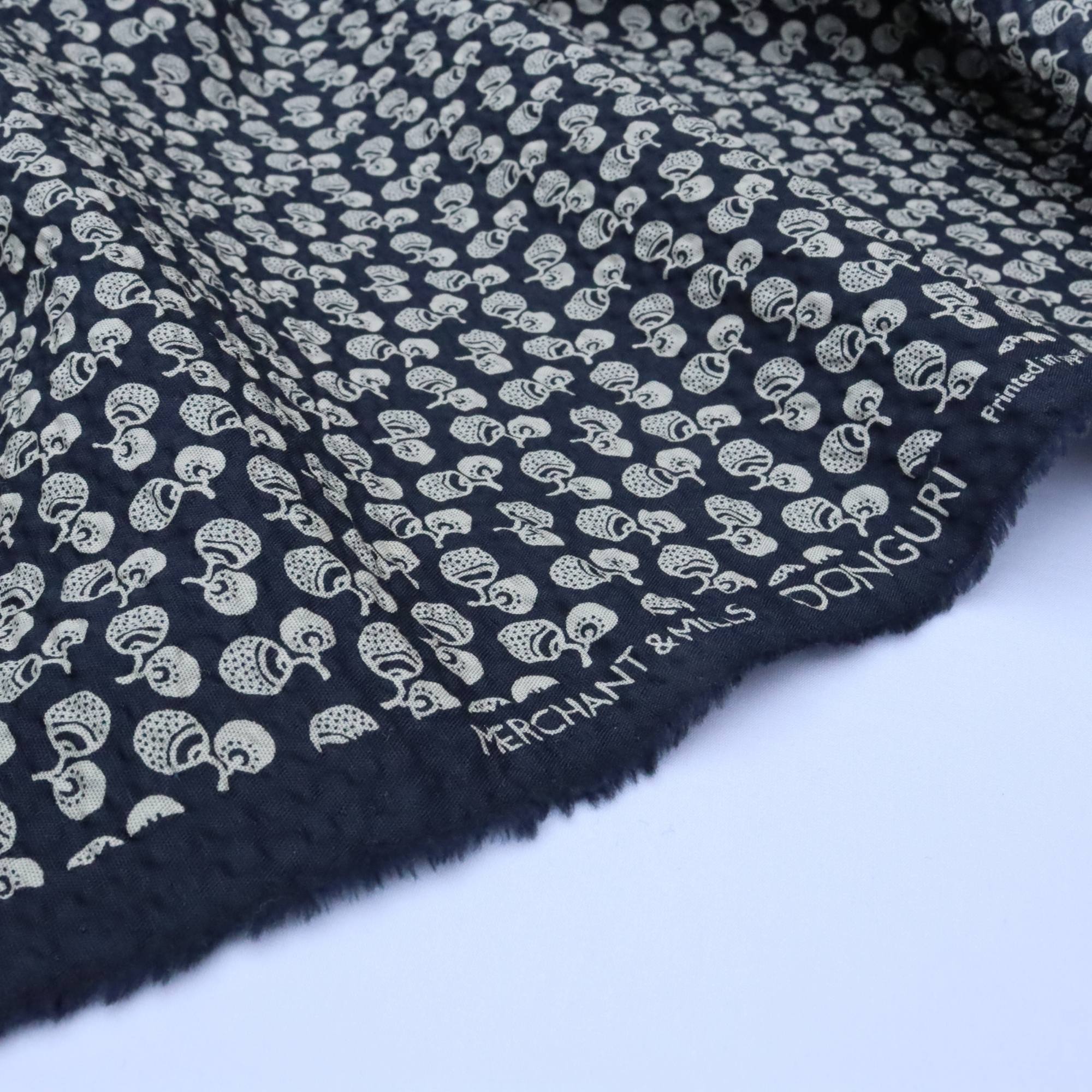 Navy fabric with white pattern and &