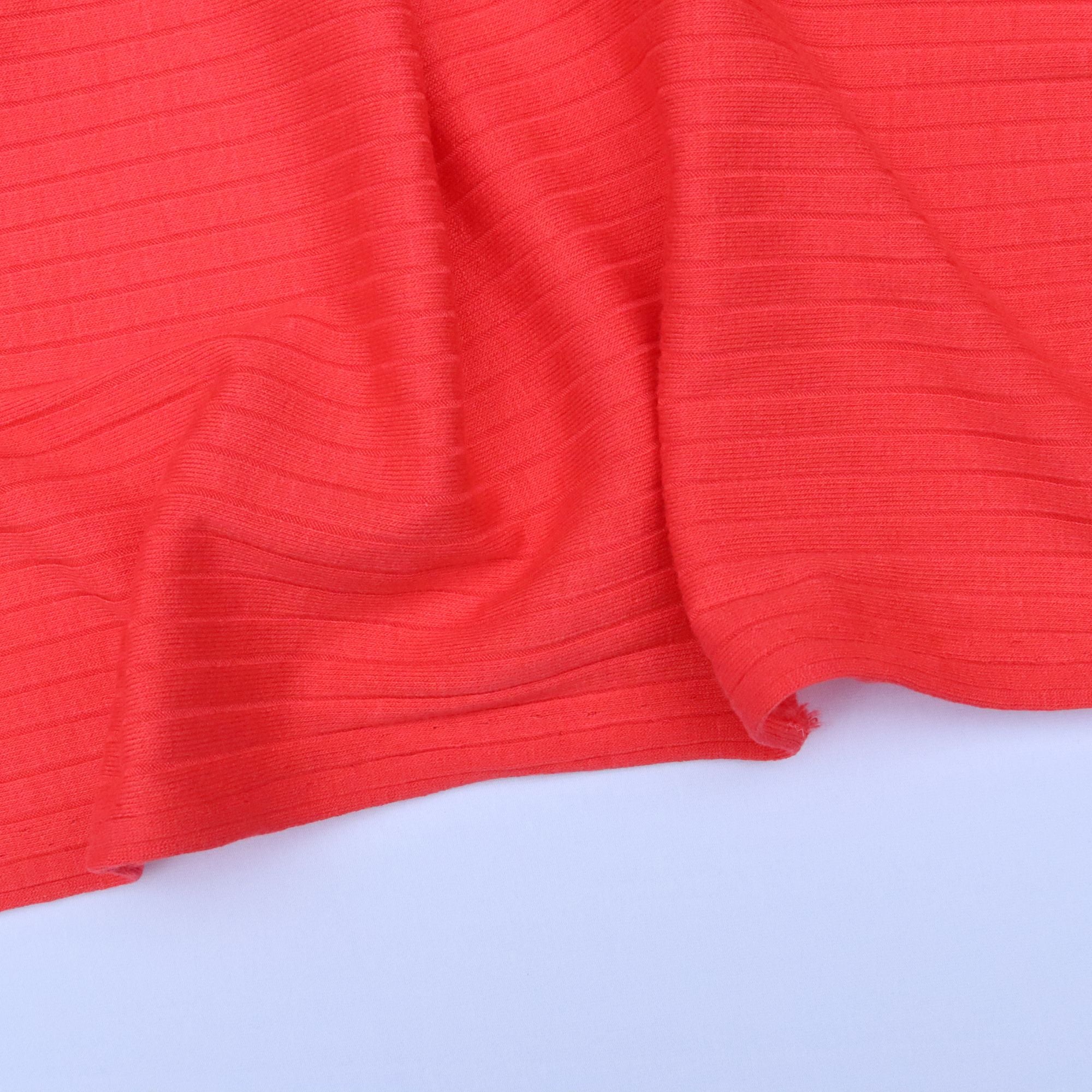 Close-up of red textured fabric on a white background