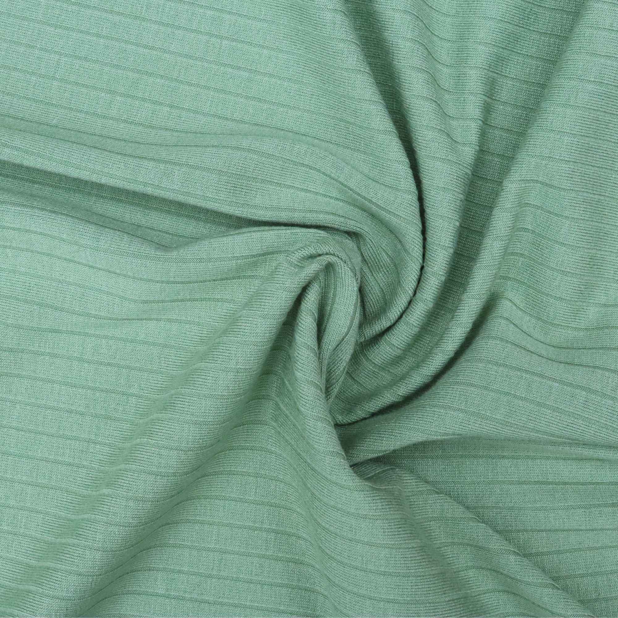 Close-up of green fabric with a textured pattern