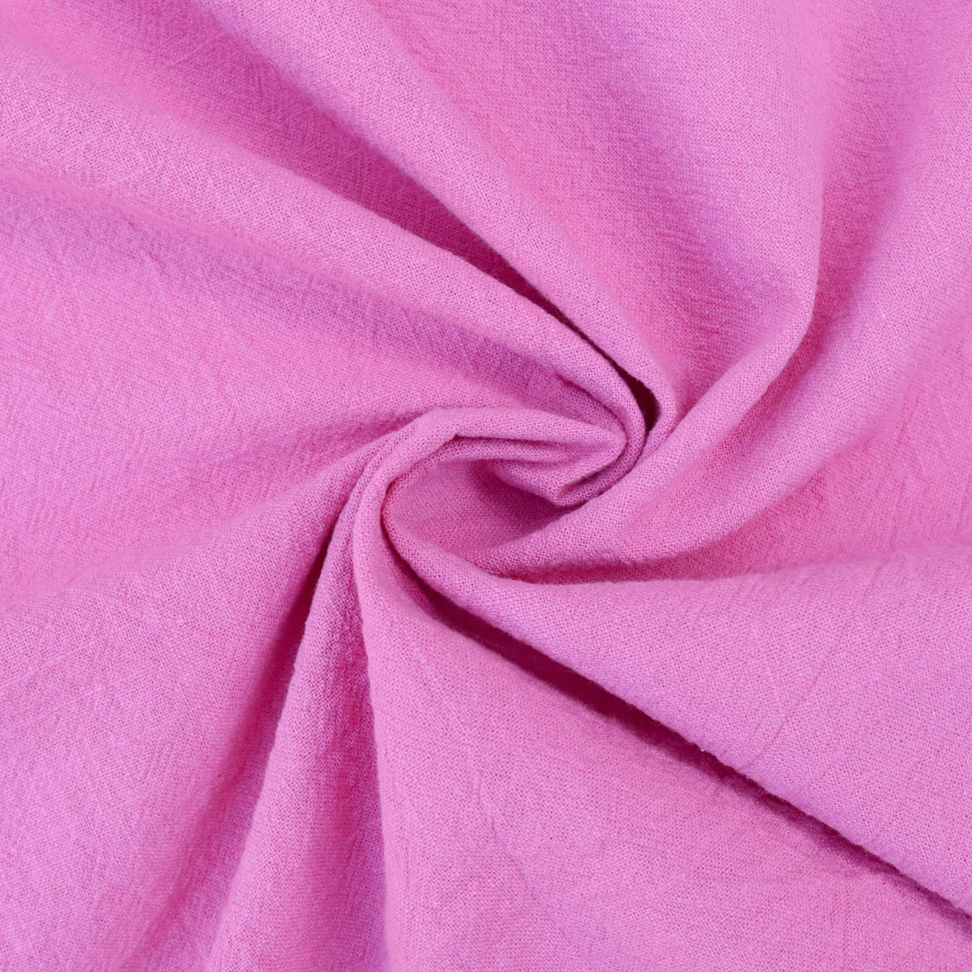 rose coloured vintage cotton fabric swirled up to show the density