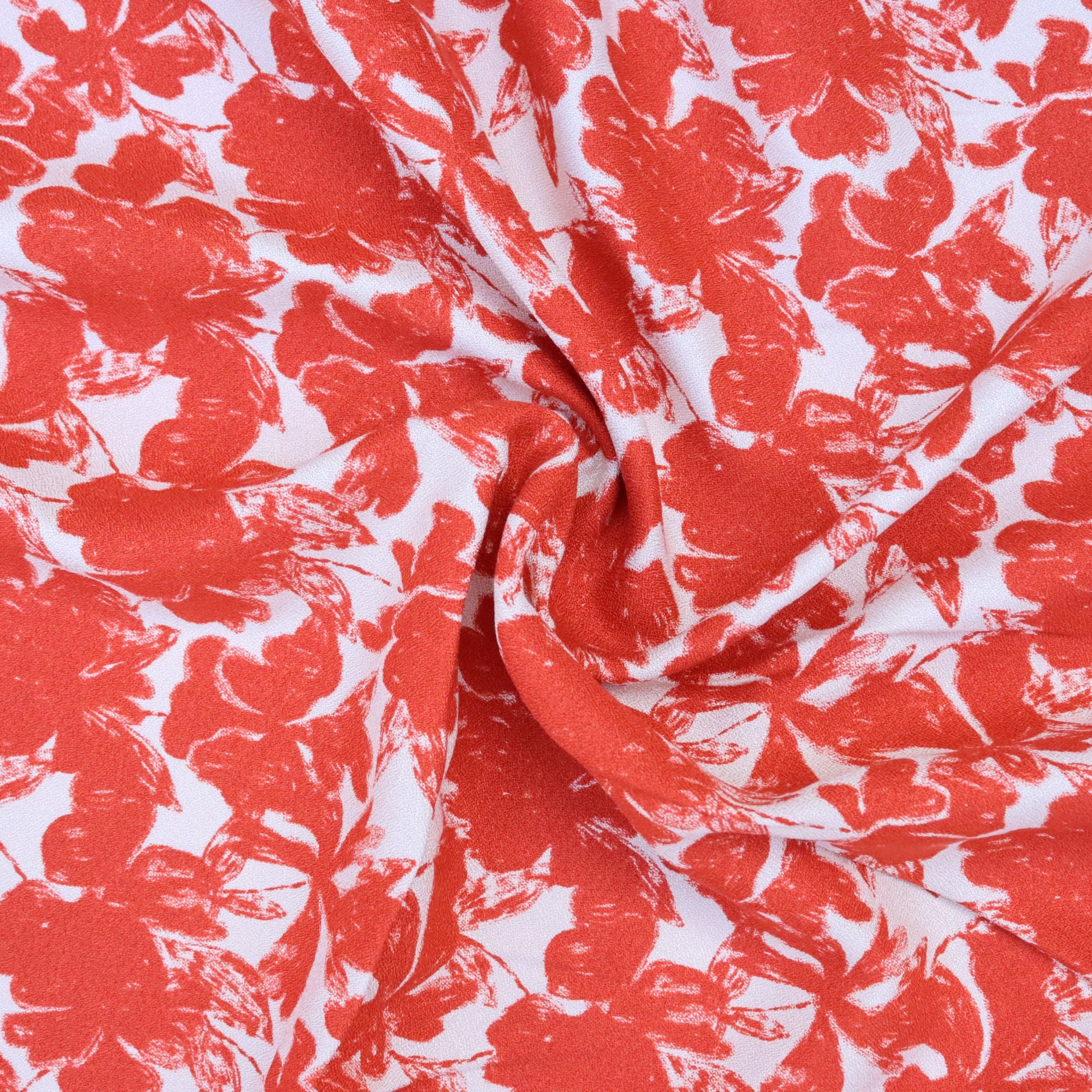 Red floral pattern on white fabric