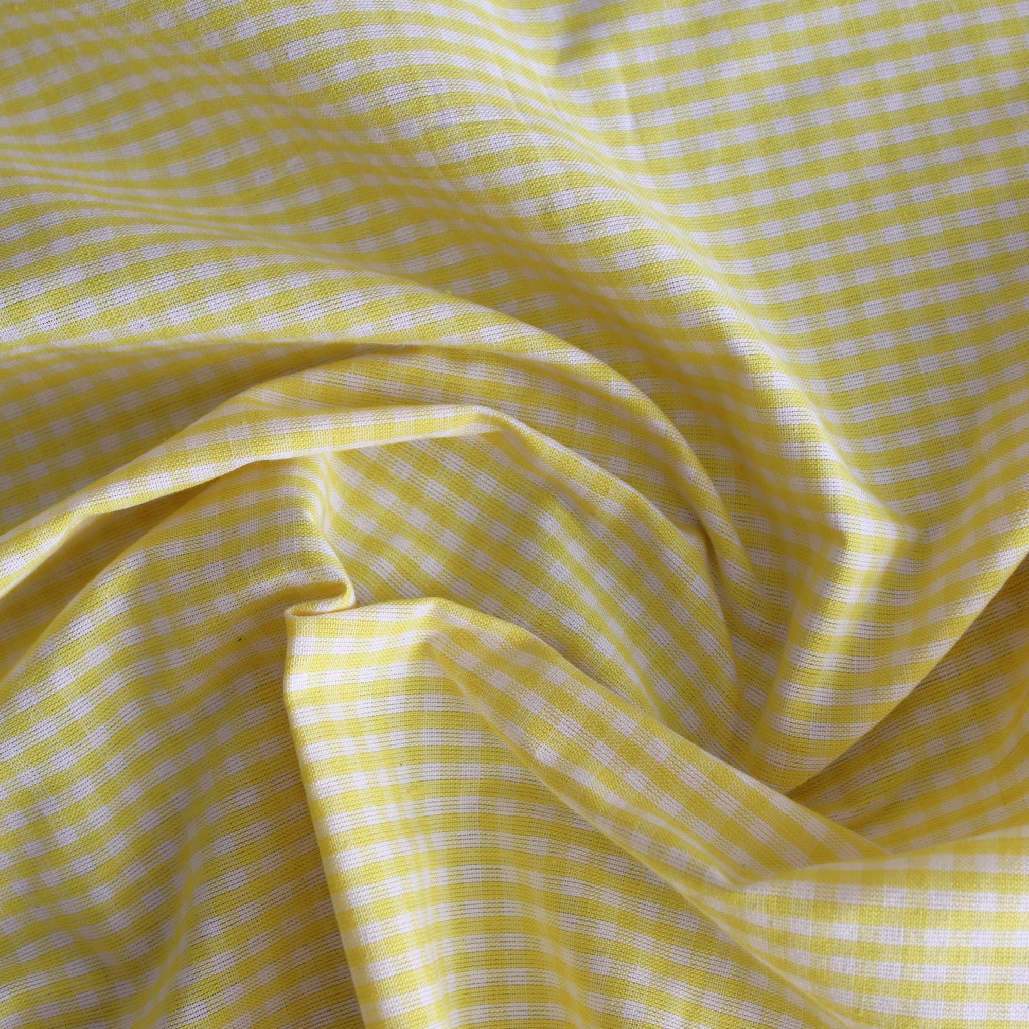 Yellow checkered fabric with a subtle pattern