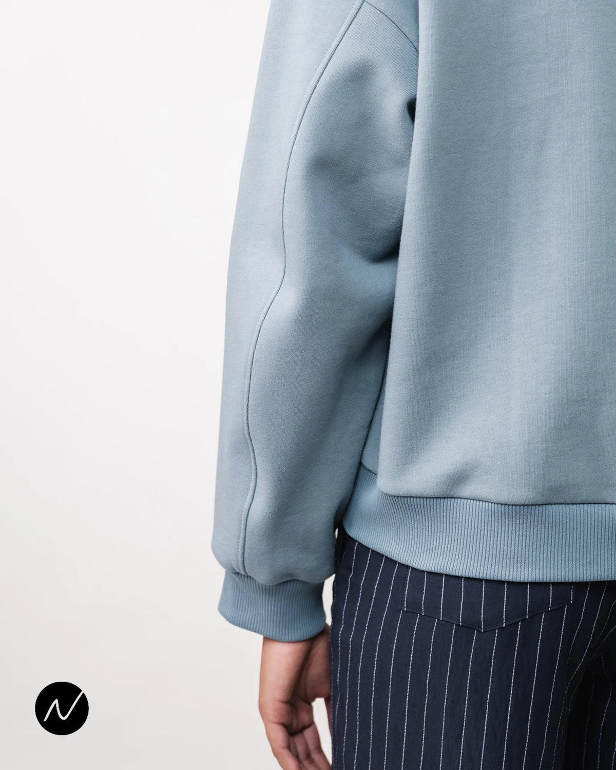 Blue sweatshirt sleeve, with flawless seams in a sweatshirt fabric.