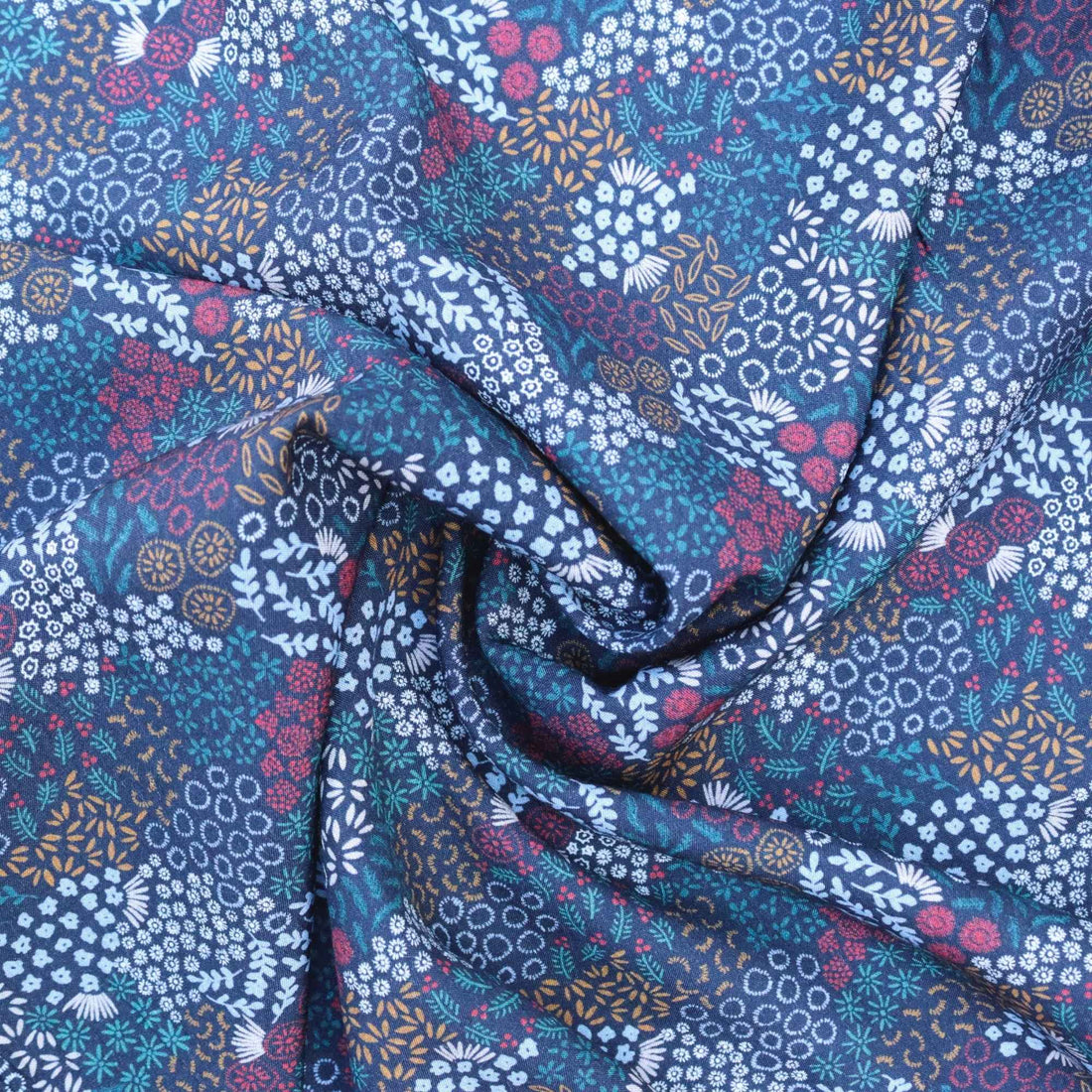 Floral patterned fabric with blue, purple, and white colors.