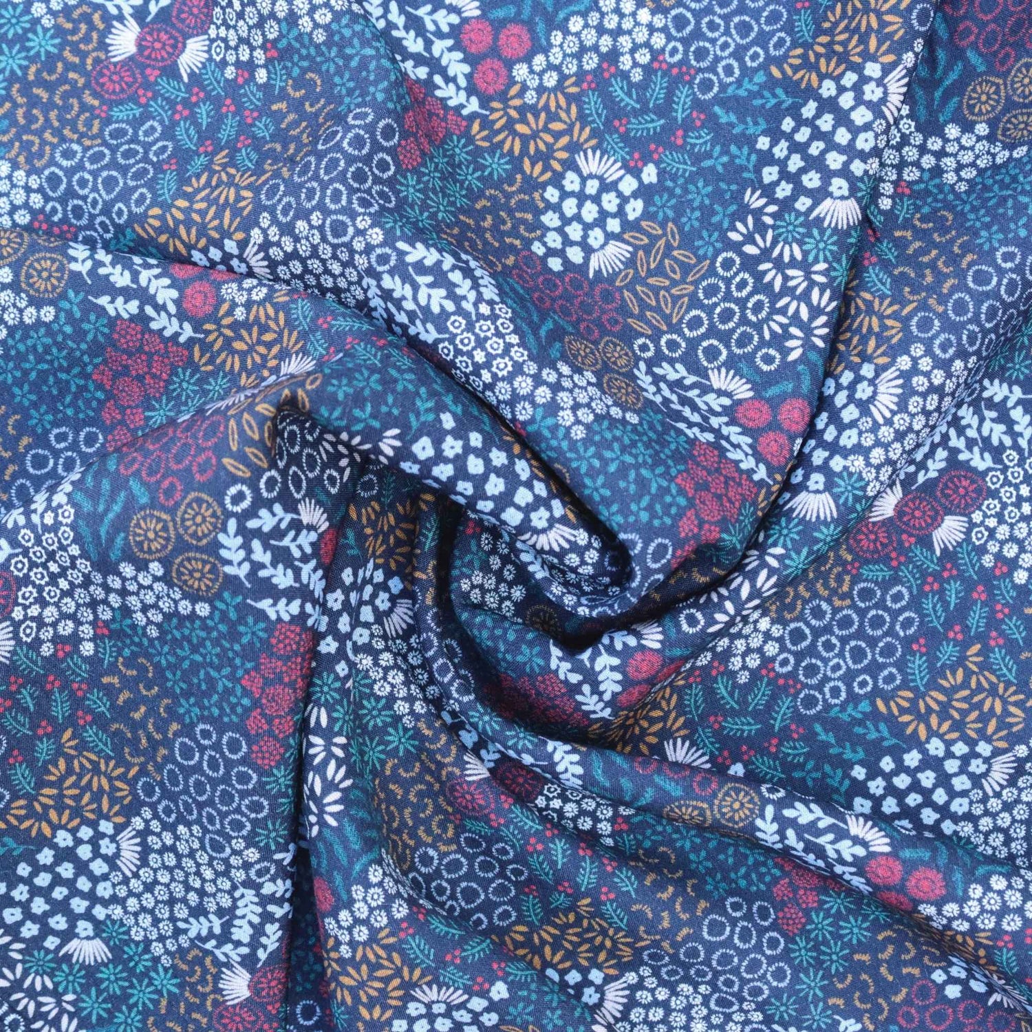 Floral patterned fabric with blue, purple, and white colors.