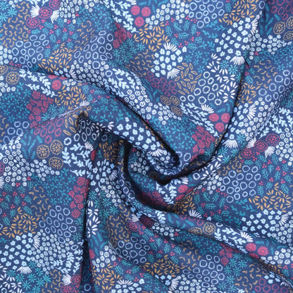 Floral patterned fabric with blue, purple, and white colors.