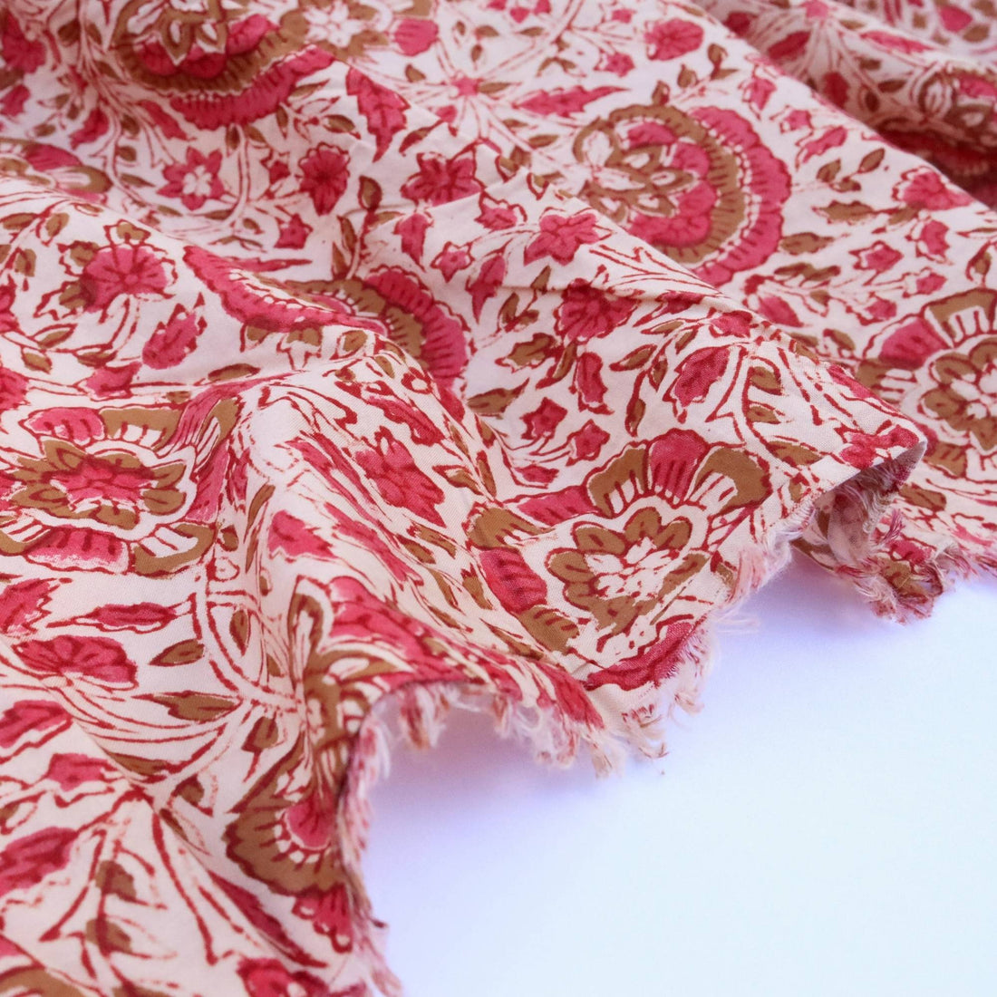 Red and white patterned fabric on a white background