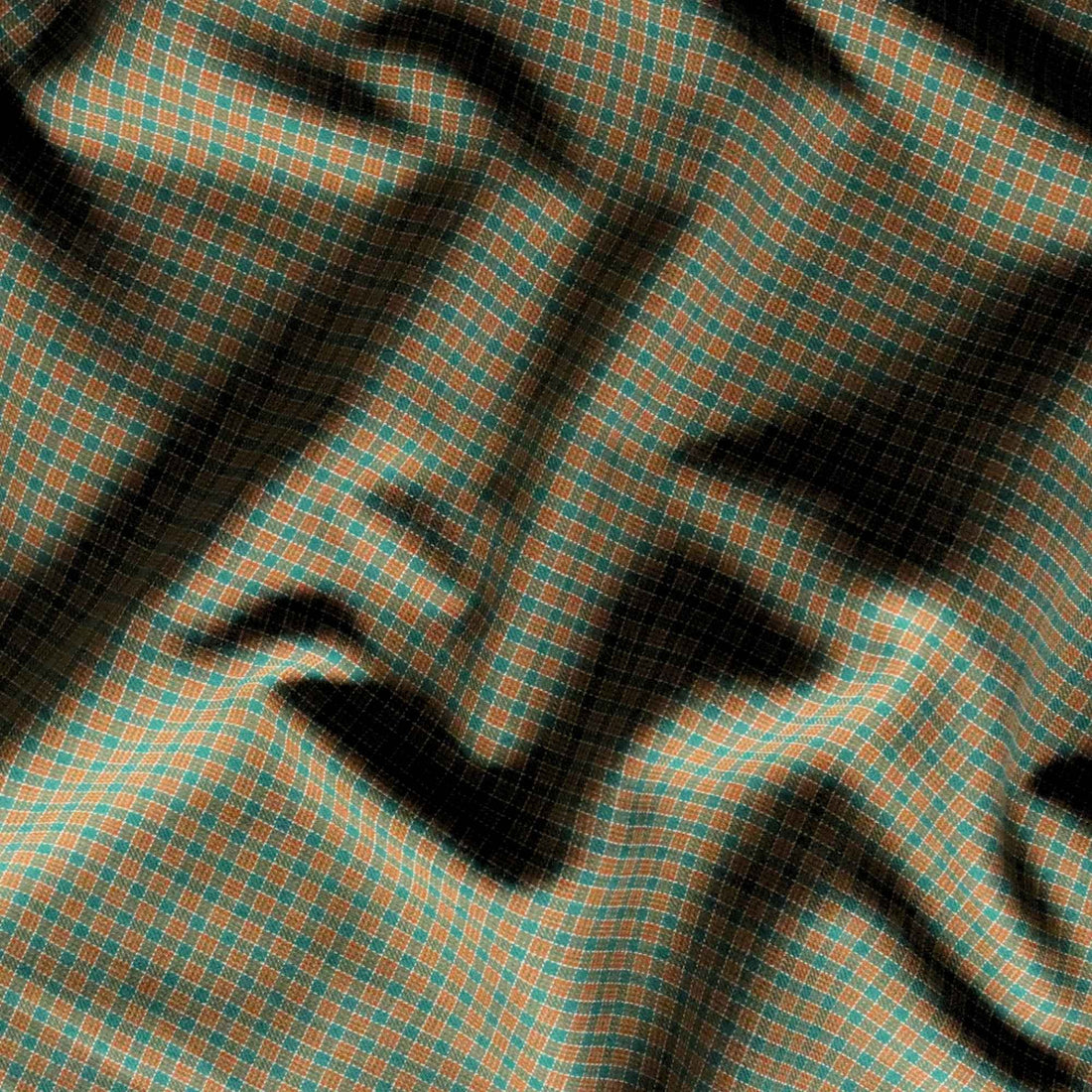 Close-up of checkered fabric with green and orange pattern