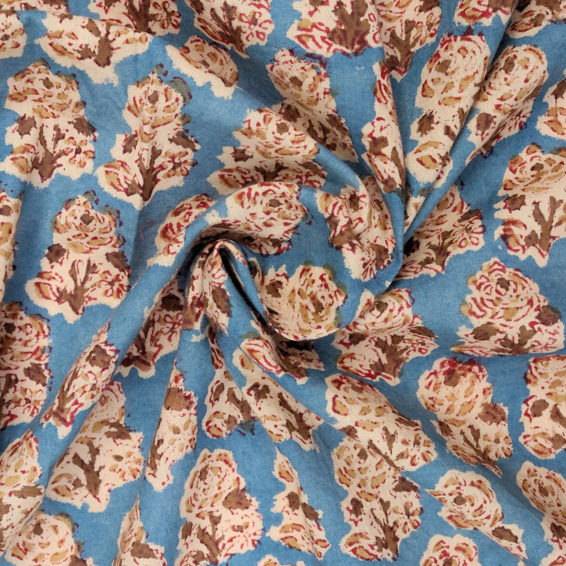 Floral patterned fabric with a blue background