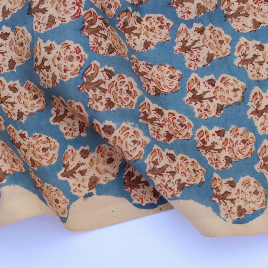 Floral patterned fabric with blue background