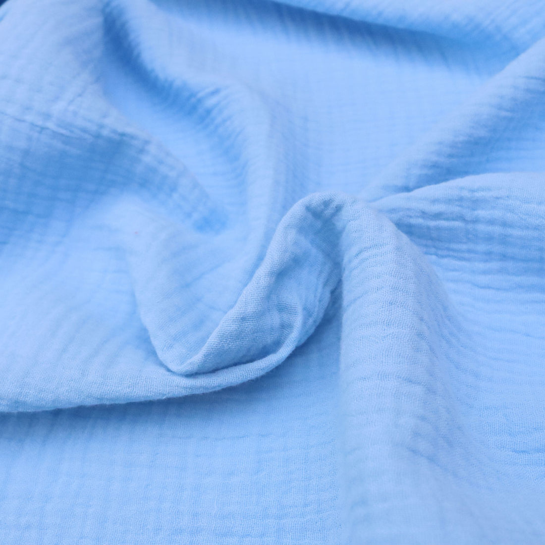 Close-up of blue fabric with a textured pattern