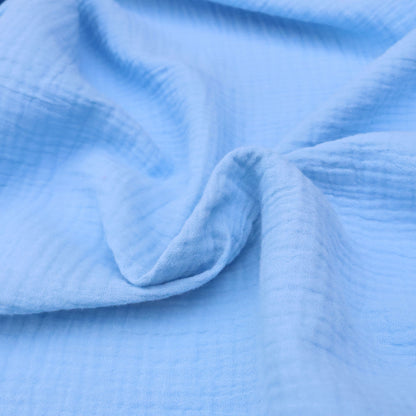 Close-up of blue fabric with a textured pattern