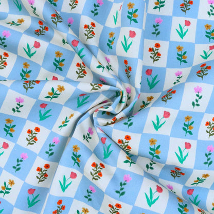 Floral patterned fabric with blue and white checkered background