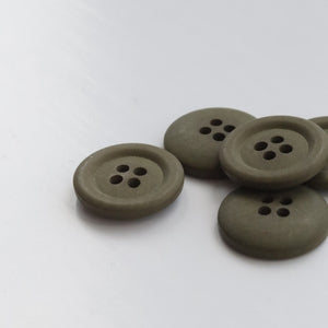 Set of five olive green buttons on a white background