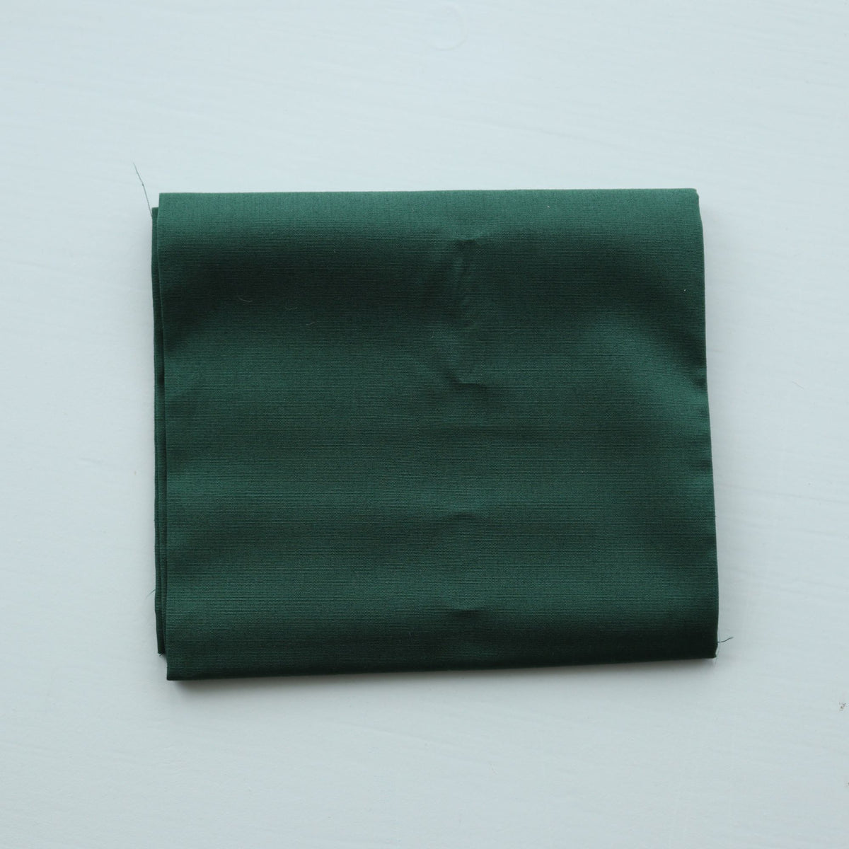 fat quarter green fabric on a white background
