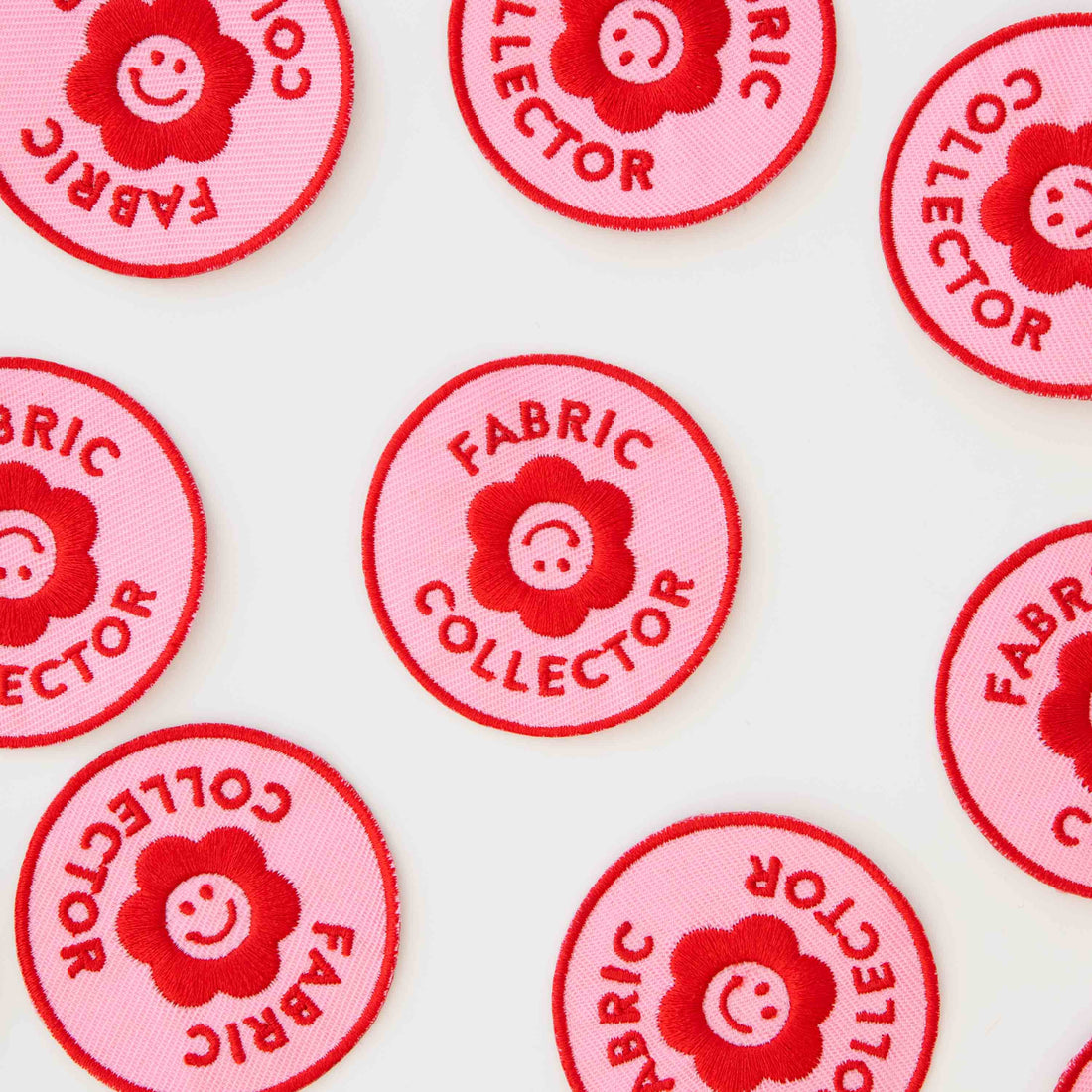 Multiple Iron on Patches for Fabric Collectors laid out around each other. The iron on patch saying &