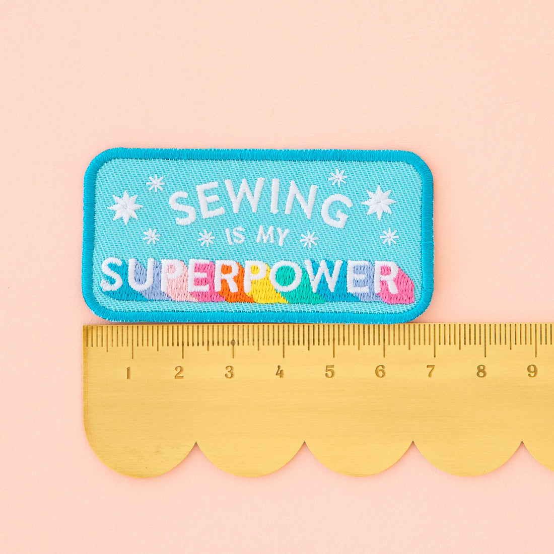 Embroidered patch with &
