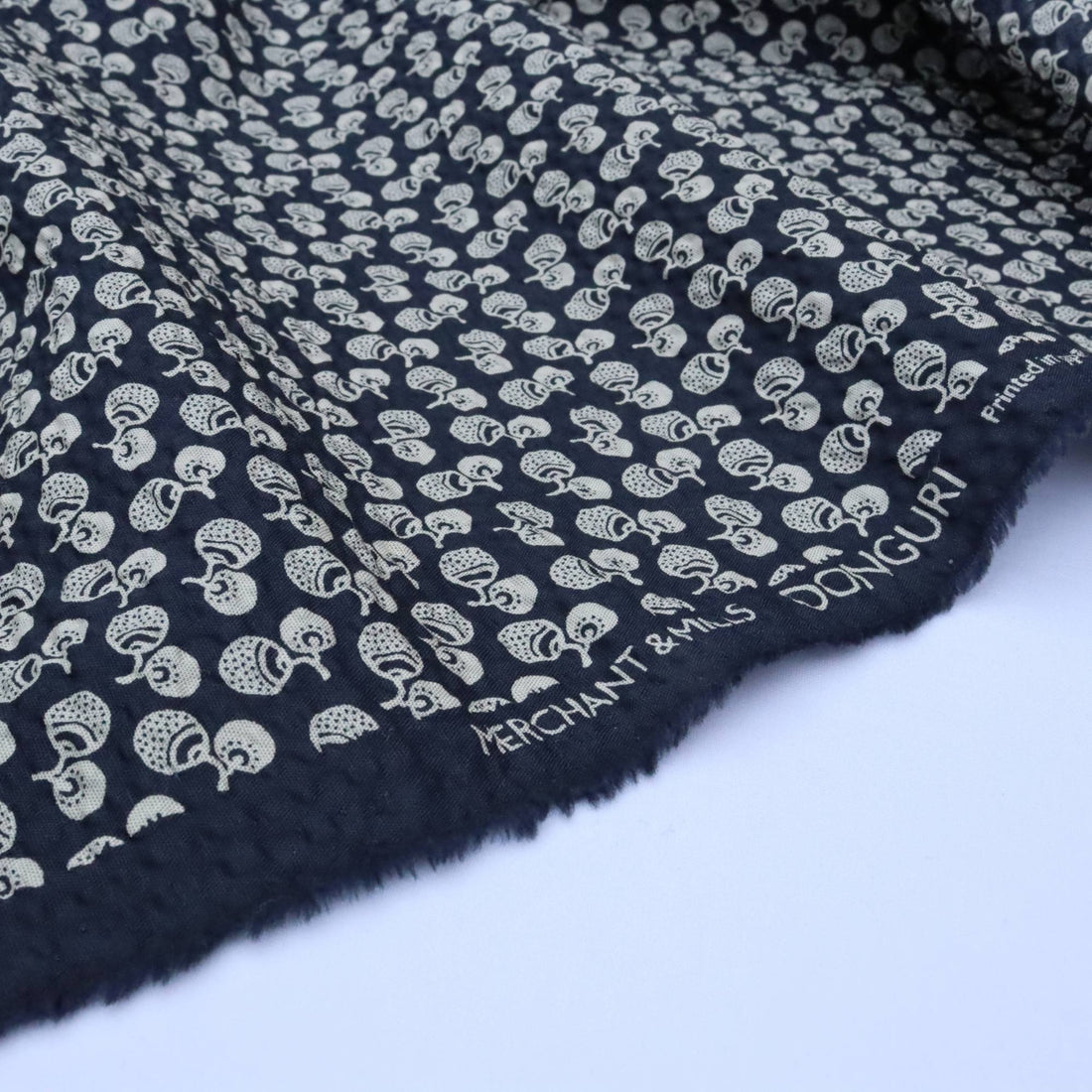 Navy fabric with white pattern and &