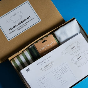 project sewing kit open with fabric, pattern, labels and thread showing