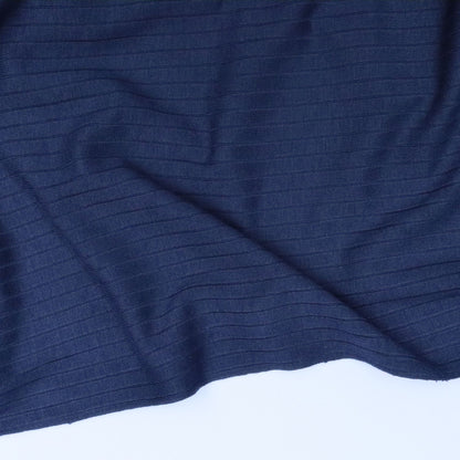 Close-up of blue textured fabric with a white base