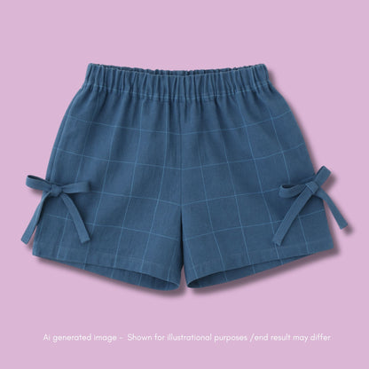 Blue checkered shorts with ties on a pink background