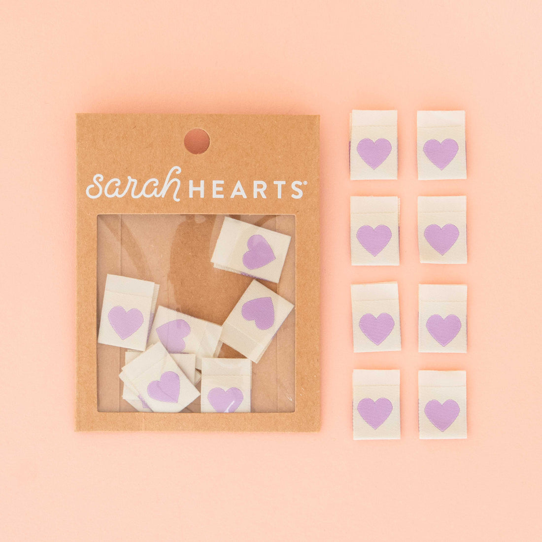 Packaged product of Sarah Hearts Labels with heart-shaped purple on a plain background.