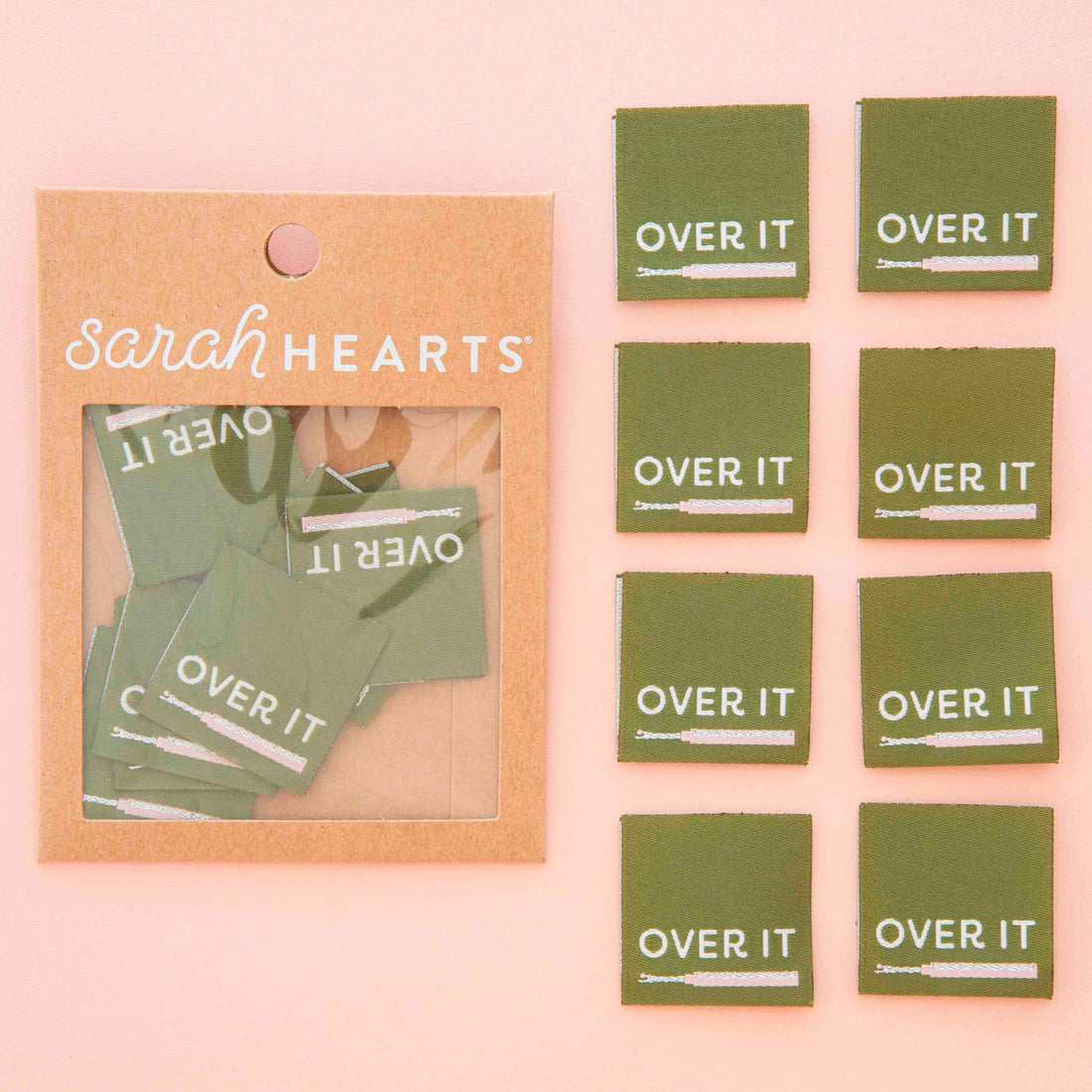 Packaged product with green woven labels with the design &
