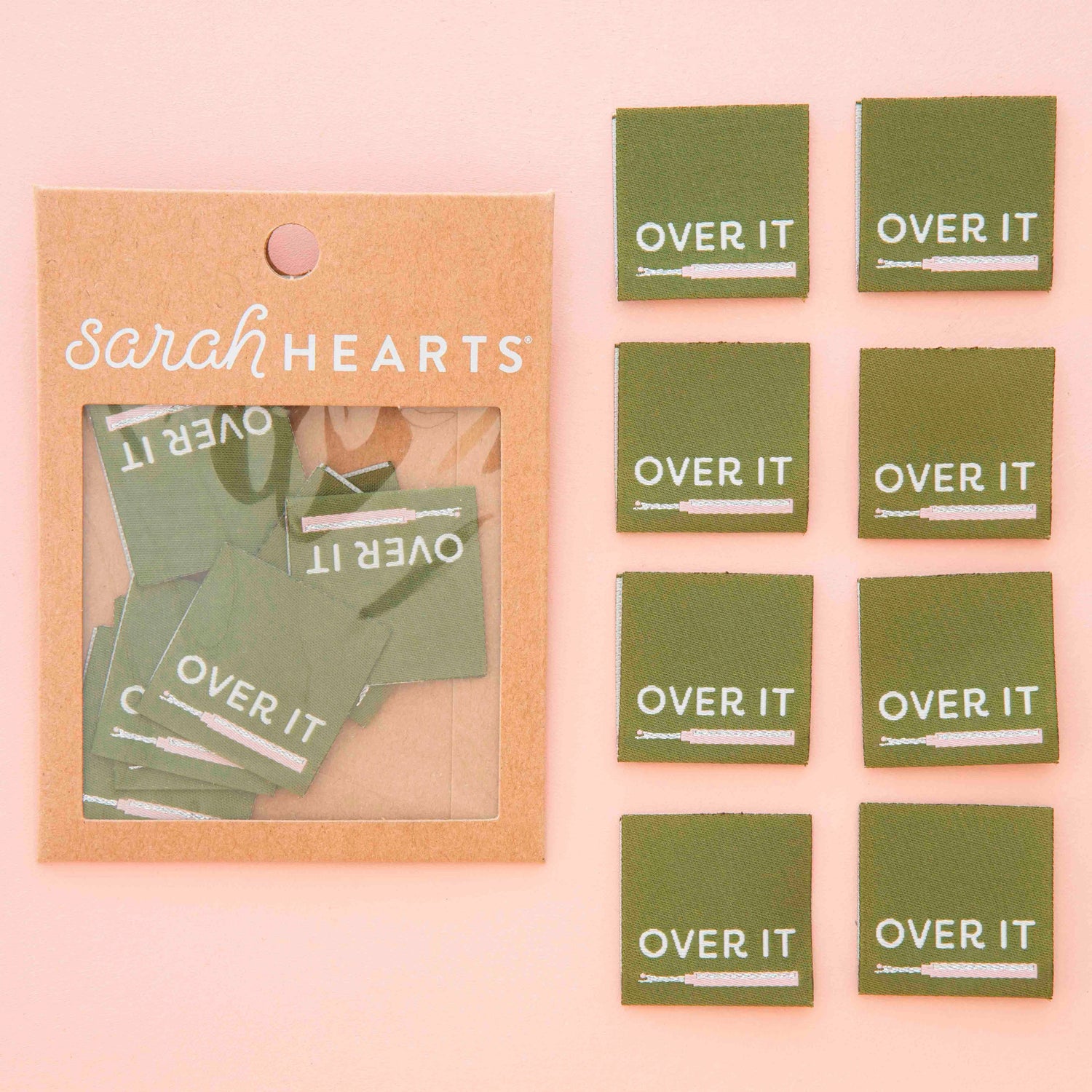Packaged product with green woven labels with the design &