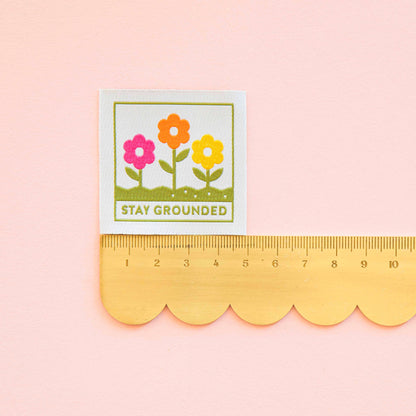 Colourful flower label with &