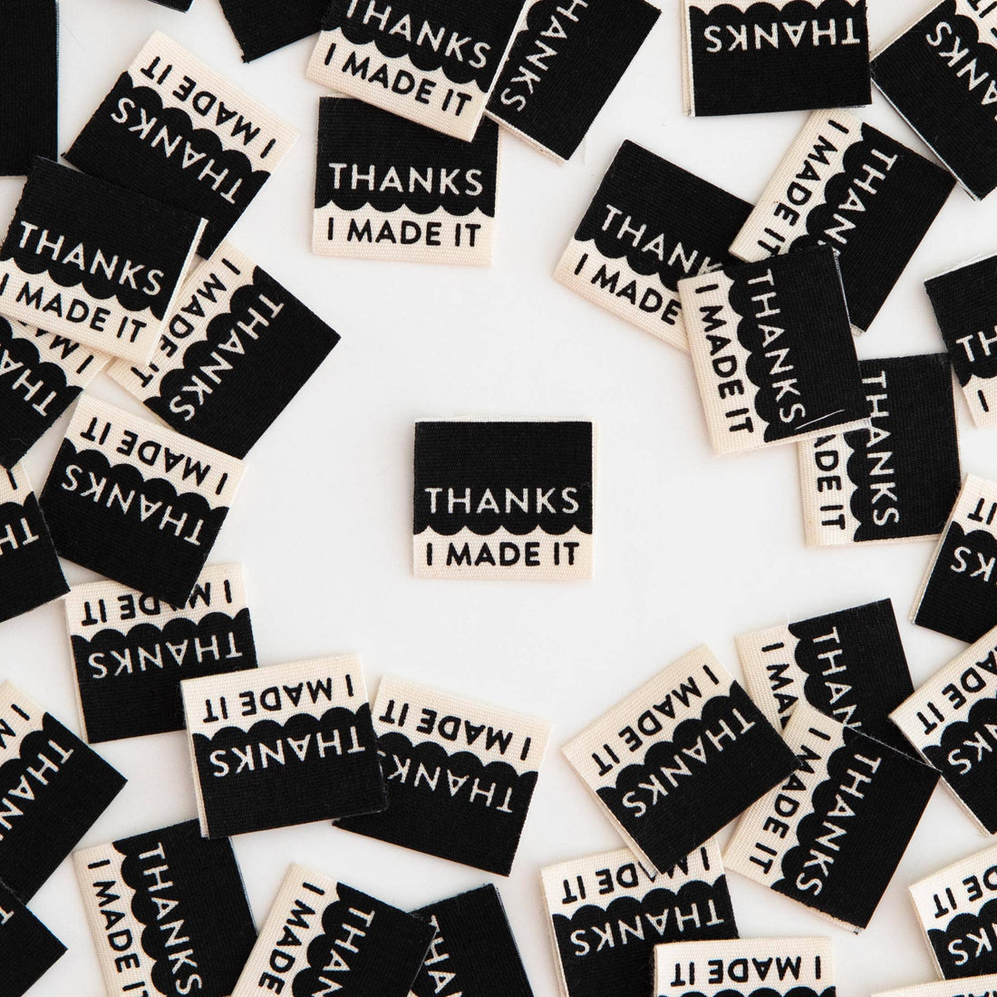 White organic cotton tags with the text &