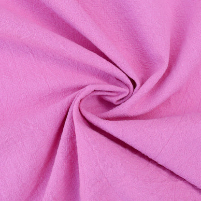 rose coloured vintage cotton fabric swirled up to show the density