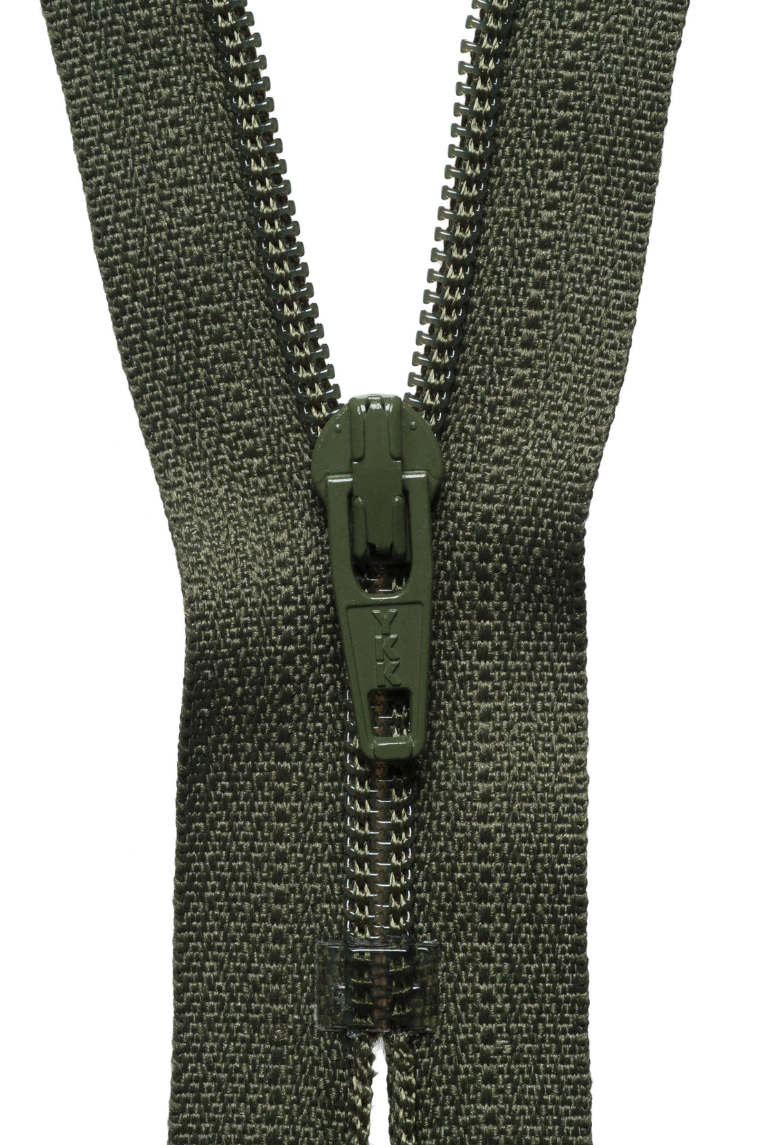 Close-up of a green zipper on a white background