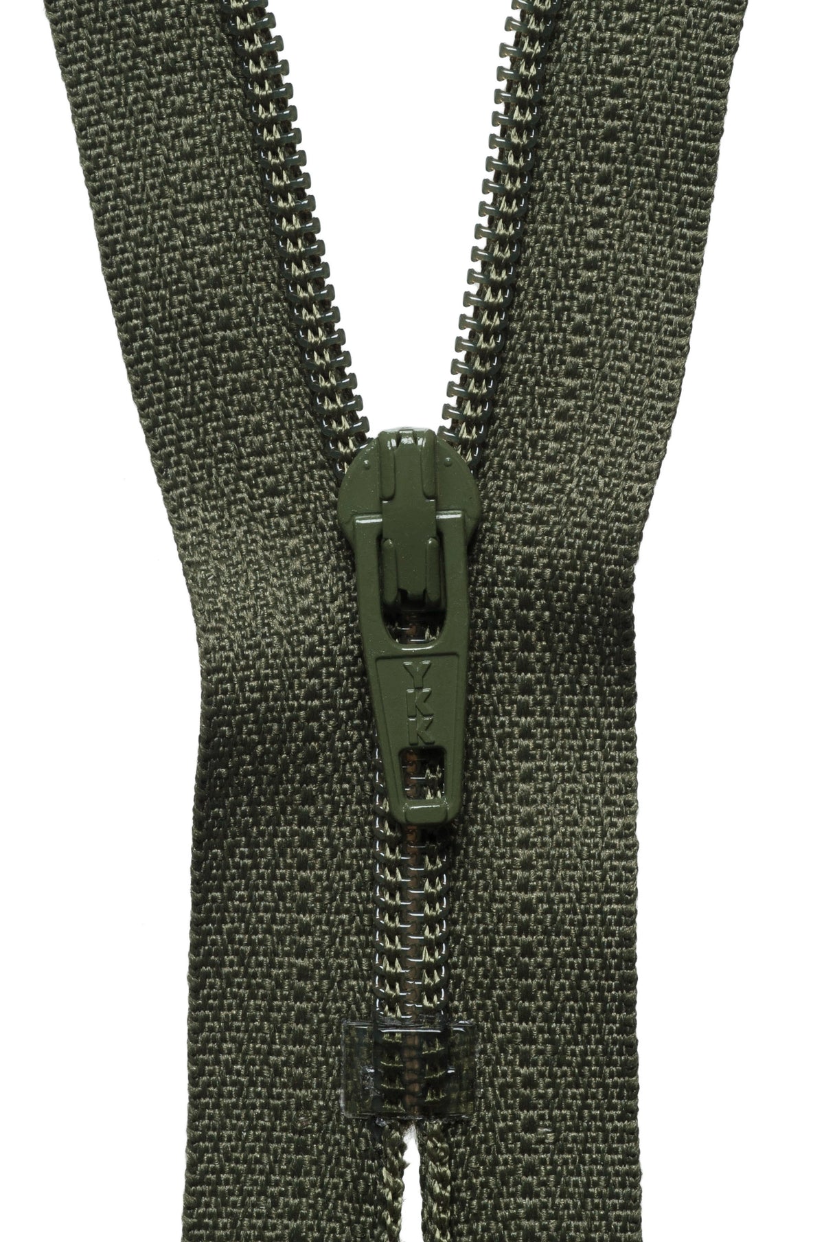 Close-up of a green zipper on a white background
