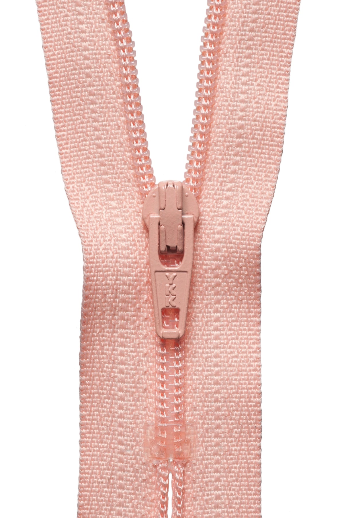 A close-up of a light pink zipper with a matching pull tab, set against a solid white background.