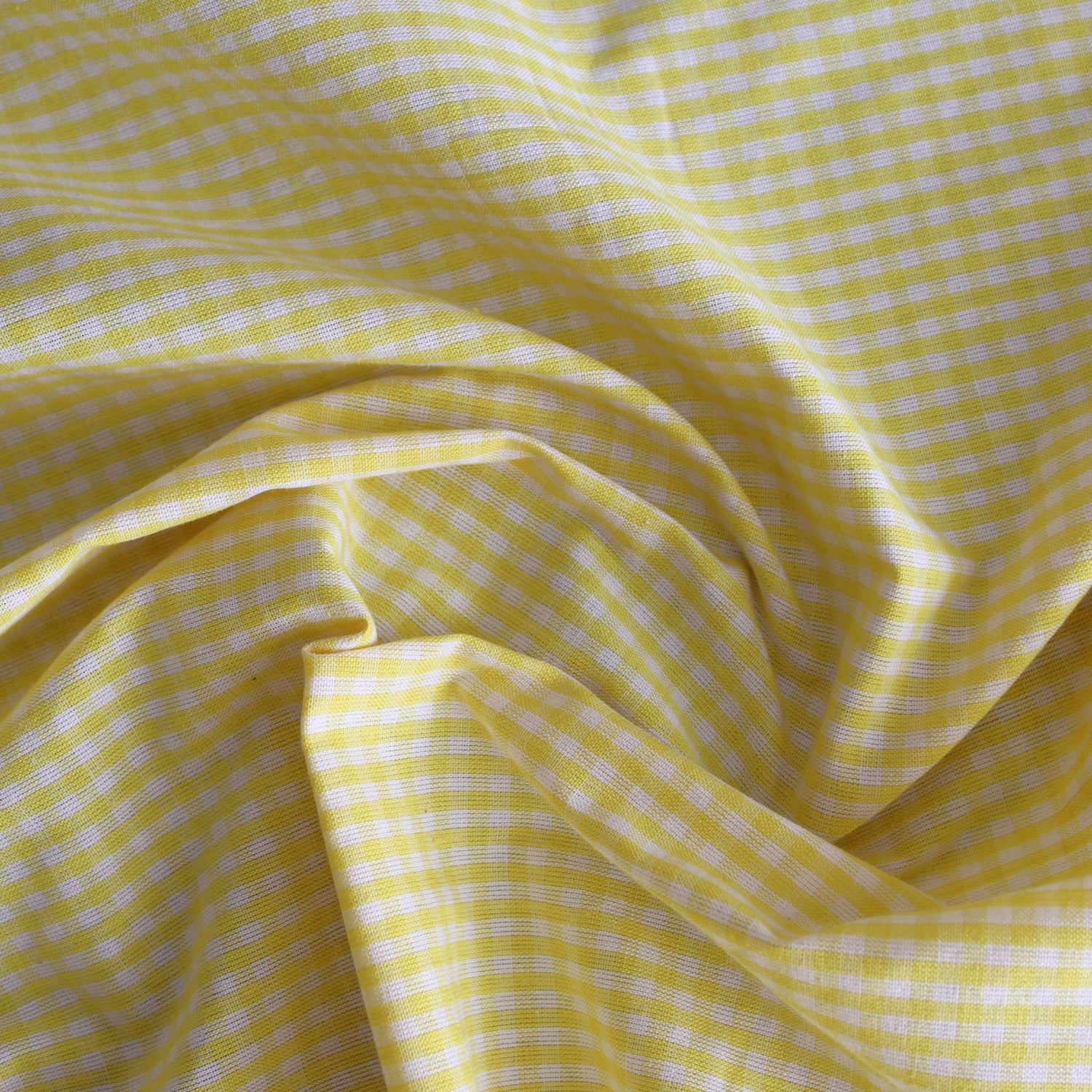 Yellow checkered fabric with a subtle pattern