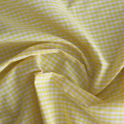 Yellow checkered fabric with a subtle pattern